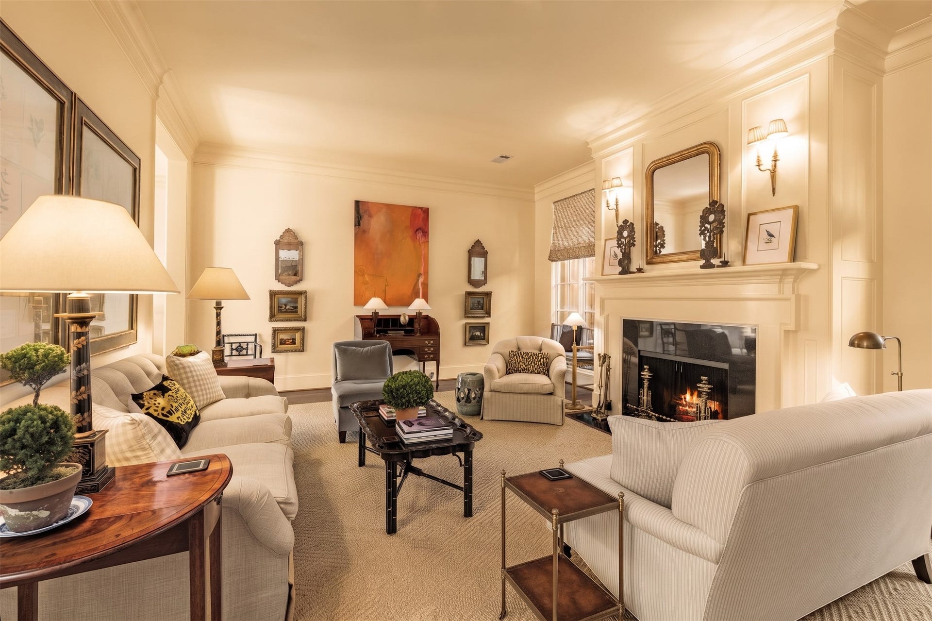 2820 Ferndale Street, Houston, TX 77098 Living Room Wood-Burning Fireplace: A hand-carved stone surround frames an authentic wood-burning hearth, bringing architectural weight and natural warmth to the room. It serves as a classic focal point for evening gatherings.