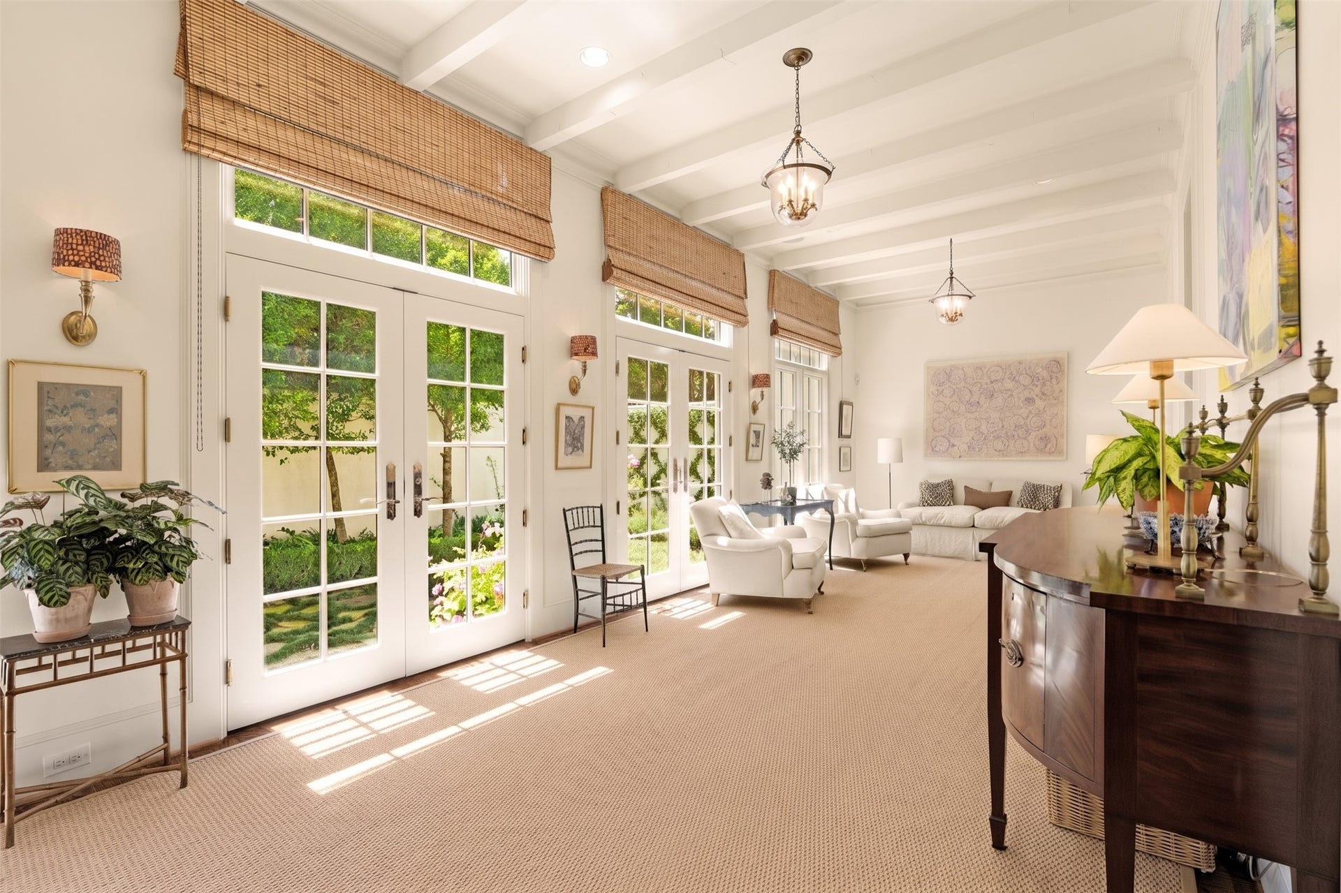 2820 Ferndale Street, Houston, TX 77098 Sunroom Gallery: Flooded with natural light through floor-to-ceiling hurricane-rated glass, this space blurs the line between indoors and out. High ceilings and custom beams add timeless character.
