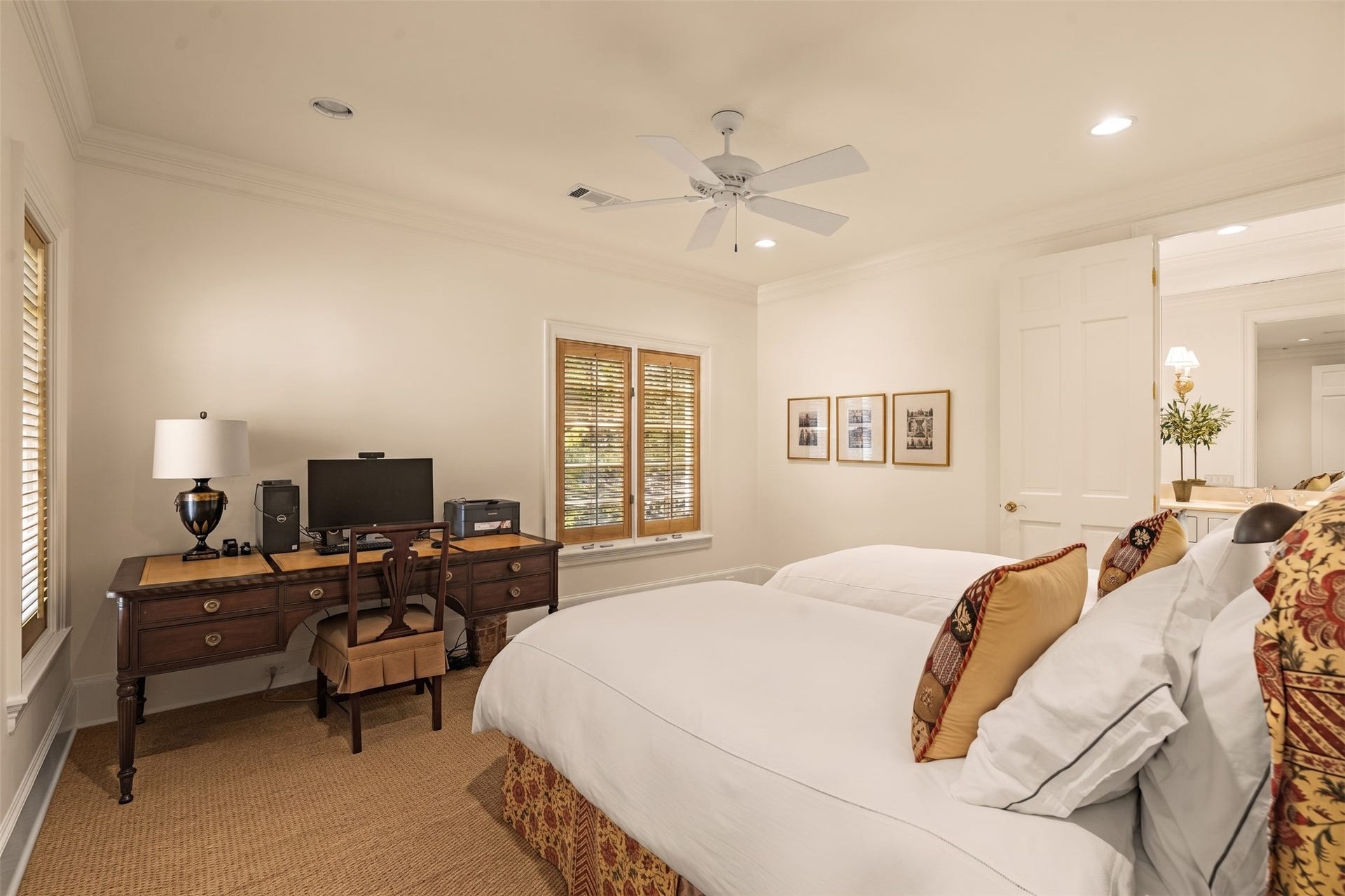 2820 Ferndale Street, Houston, TX 77098 Guest Suite #1: The first guest bedroom features a ceiling fan, high ceilings, sea grass flooring, and a large closet. It offers family or visiting guests a private accommodation.