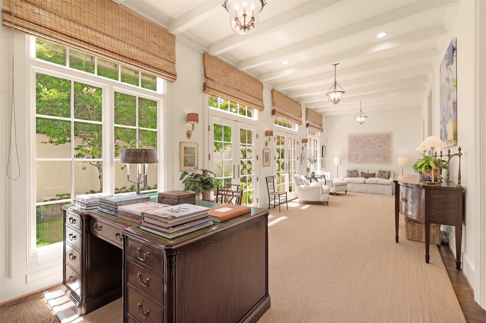 2820 Ferndale Street, Houston, TX 77098 Sunroom Gallery & Beamed Ceilings: Featuring exposed wooden ceiling beams, the gallery offers a light-filled space for relaxing or informal dining. Two sets of French doors open directly to the private courtyard.