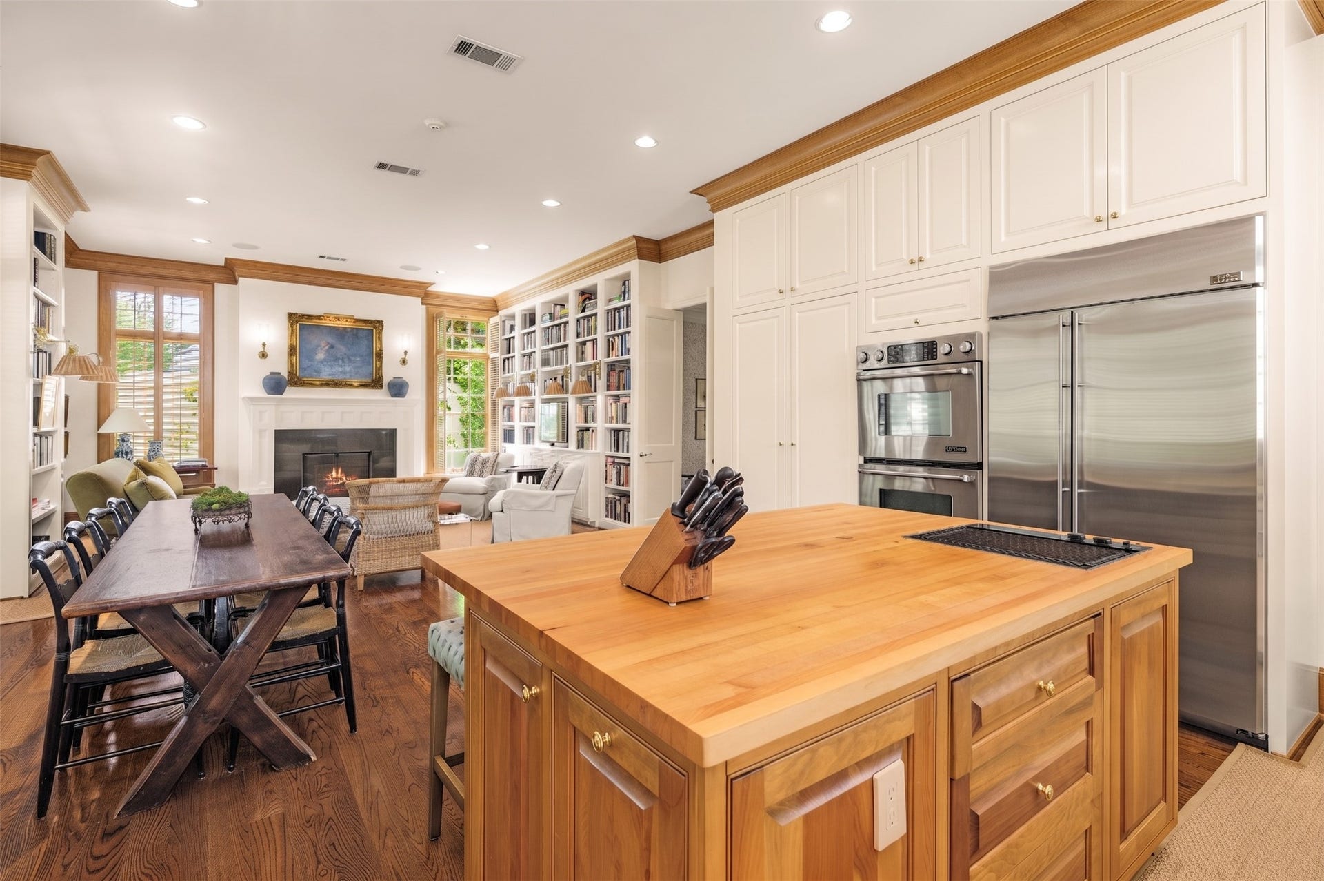 2820 Ferndale Street, Houston, TX 77098 Kitchen View to Den & Casual Dining: Opening to the den and casual dining area, establishing an easy flow for daily living. Plantation shutters and high ceilings maintain a light, comfortable scale.