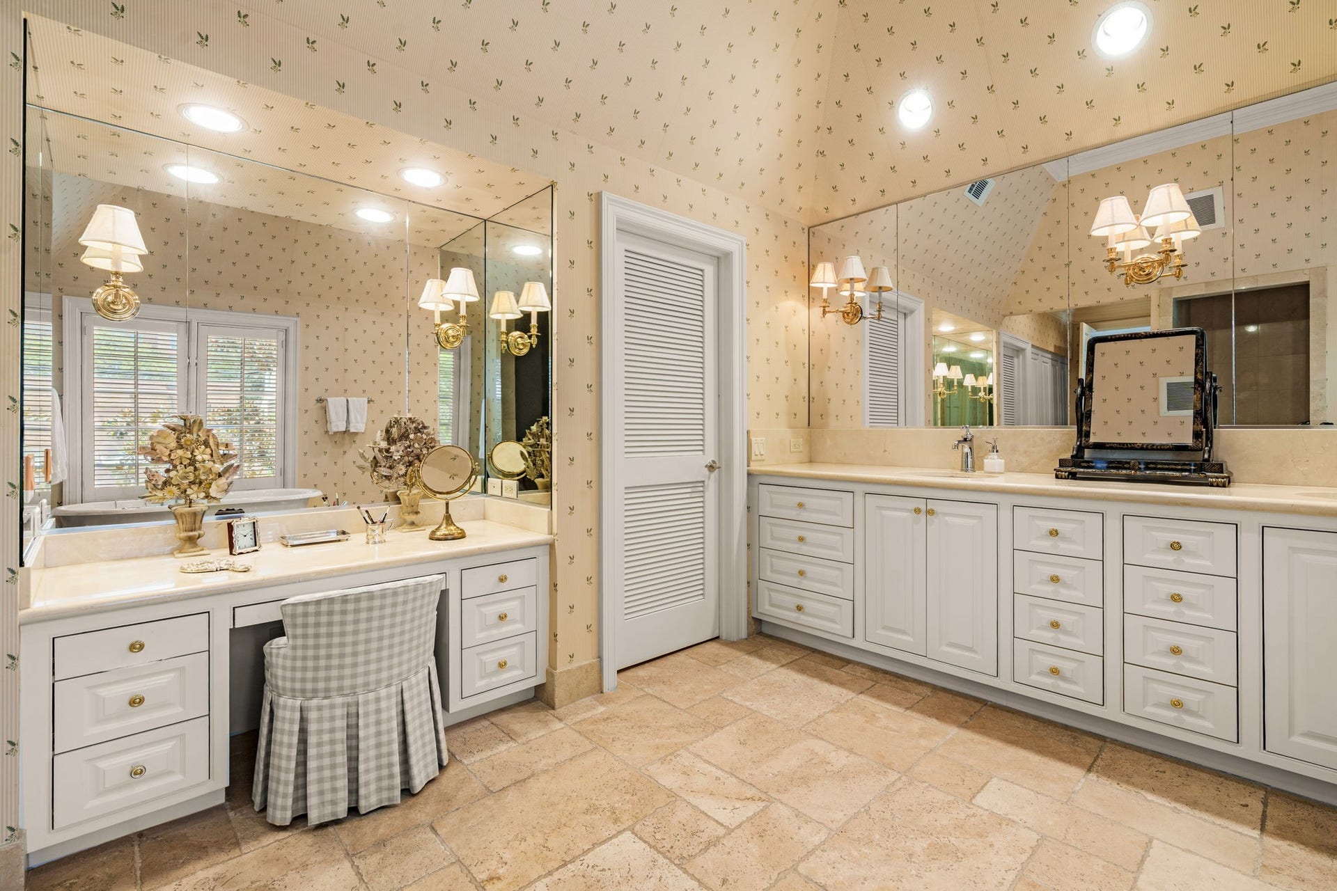 2820 Ferndale Street, Houston, TX 77098 Primary Bathroom: The primary bath features vaulted ceilings, rich marble countertops, and a dedicated ladies' vanity area. It provides a calm, well-appointed space for daily routines.