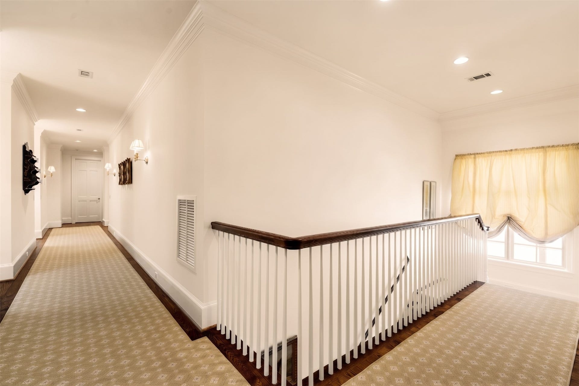 2820 Ferndale Street, Houston, TX 77098 Second-Floor Gallery Landing: The upper landing connects the primary suite, guest bedrooms, and executive study. Natural sea grass flooring provides a classic texture throughout the second level.