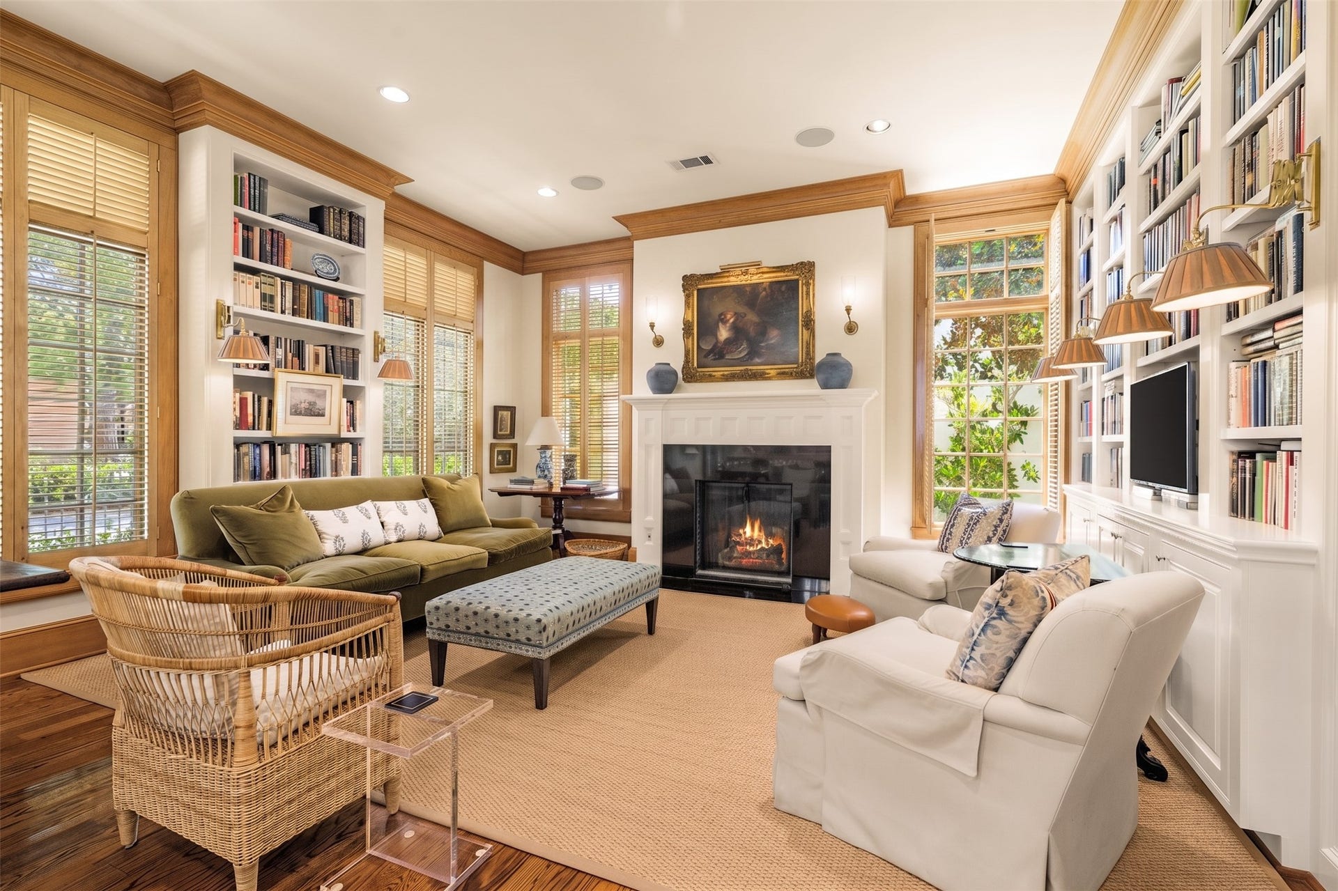 2820 Ferndale Street, Houston, TX 77098 Den & Fireside Lounge: Floor-to-ceiling windows fitted with plantation shutters flank the gas fireplace. Extensive built-in bookcases line the opposing walls.