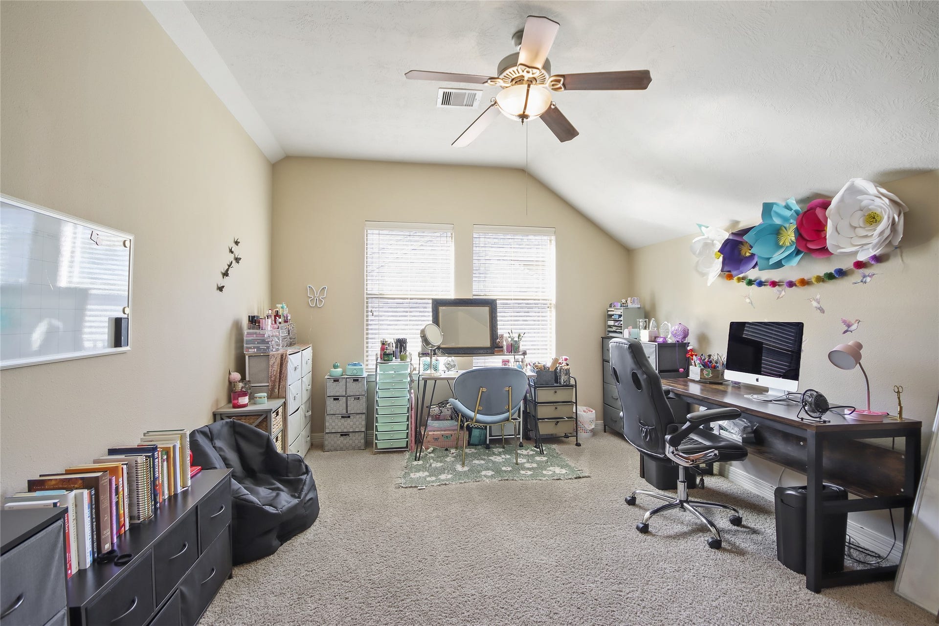Fourth bedroom located upstairs offers space and natural lighting.