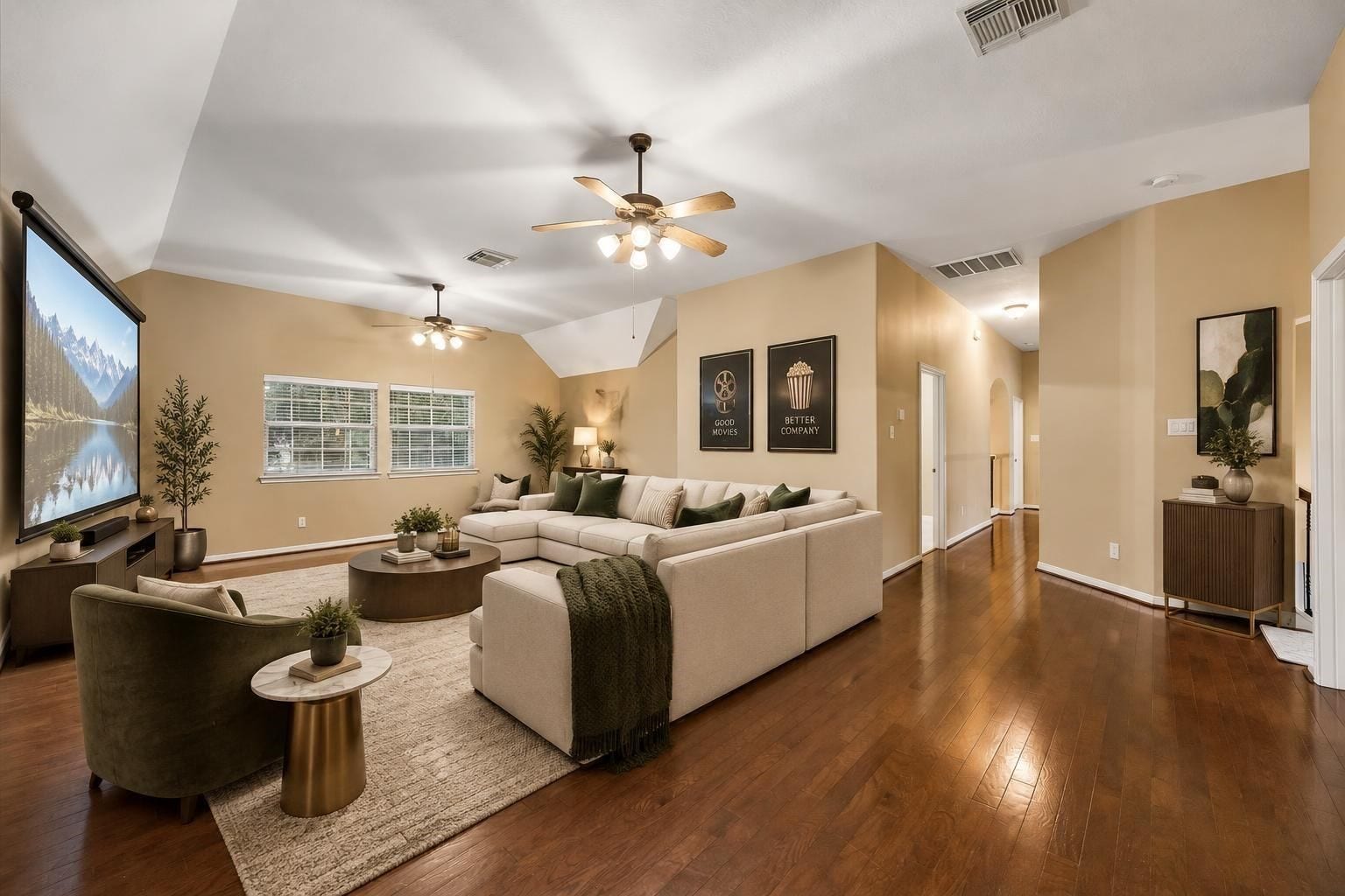 Very large flex room, virtually staged as a family media room.