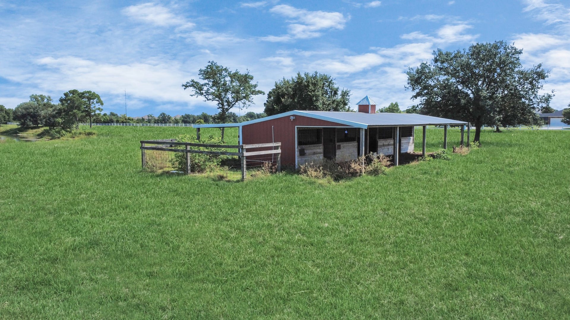 3237-2 Avenue G 1/2, Santa Fe, TX 77510 4 horse stable barn with additional storage.