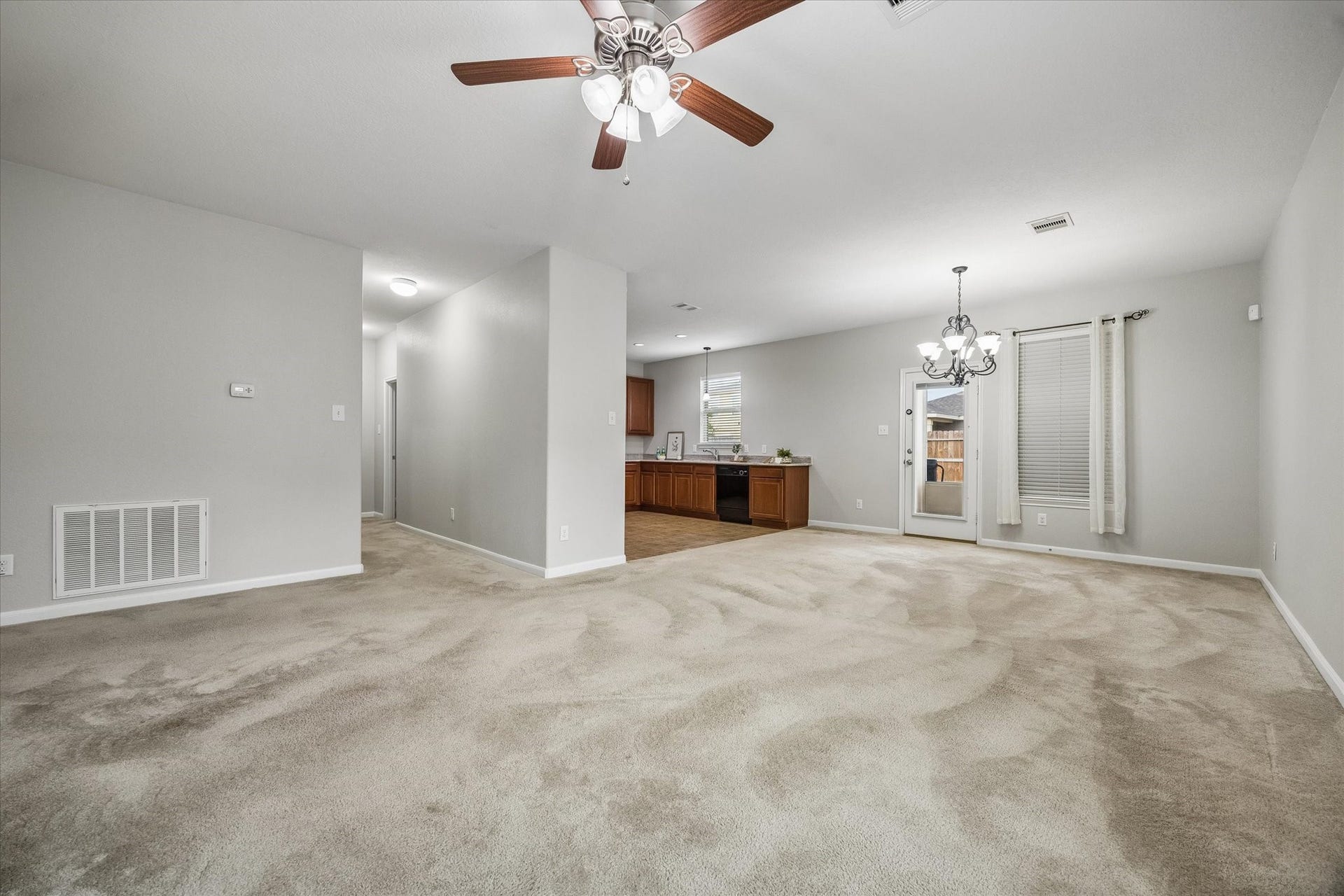 1624 Ponte Leone Lane, League City, TX 77573 An inviting living room that flows seamlessly into the kitchen and dining area.