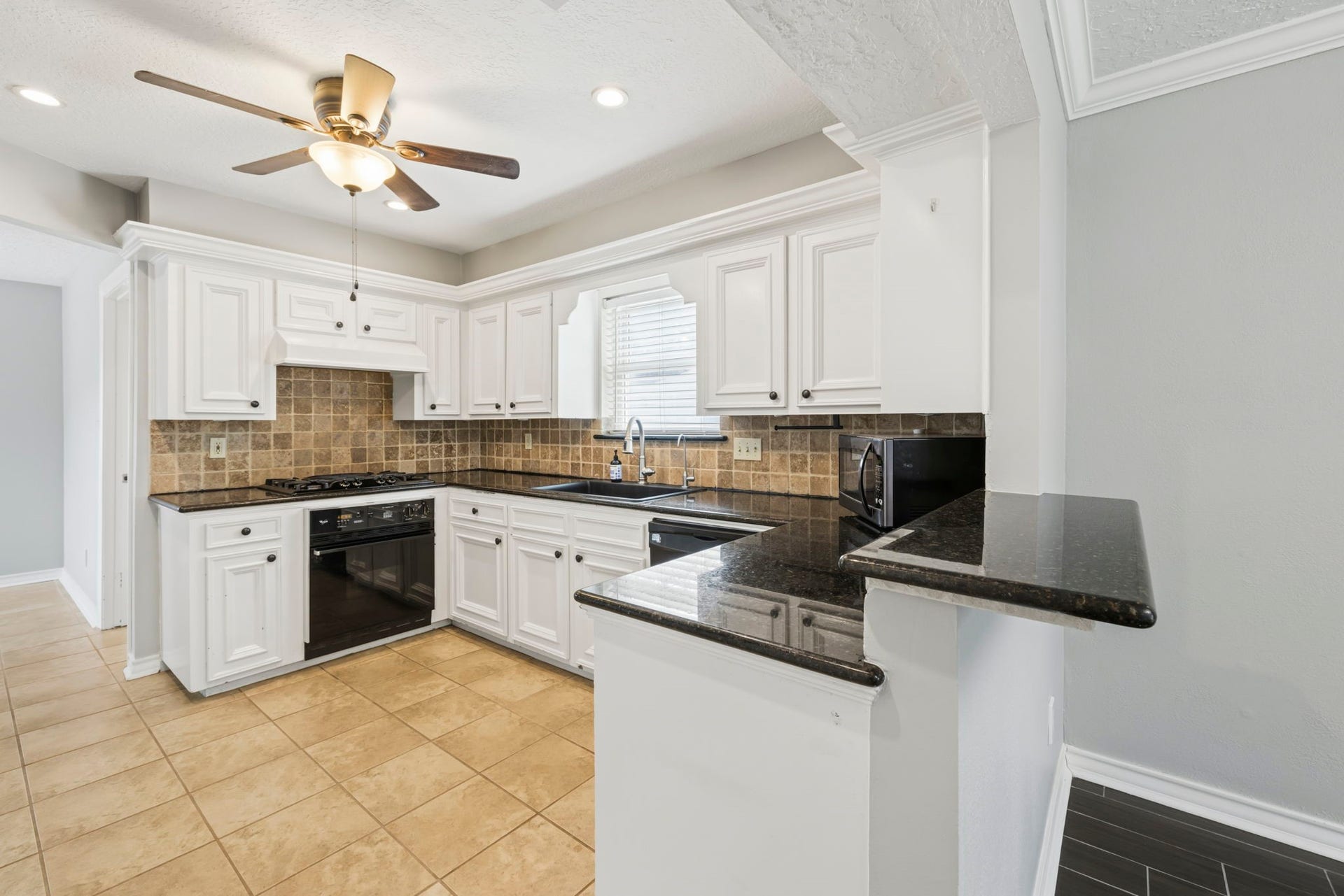 14719 Rio Pinar Drive, Houston, TX 77095 Kitchen has Gas Cooktop and Oven Directly Below it.
