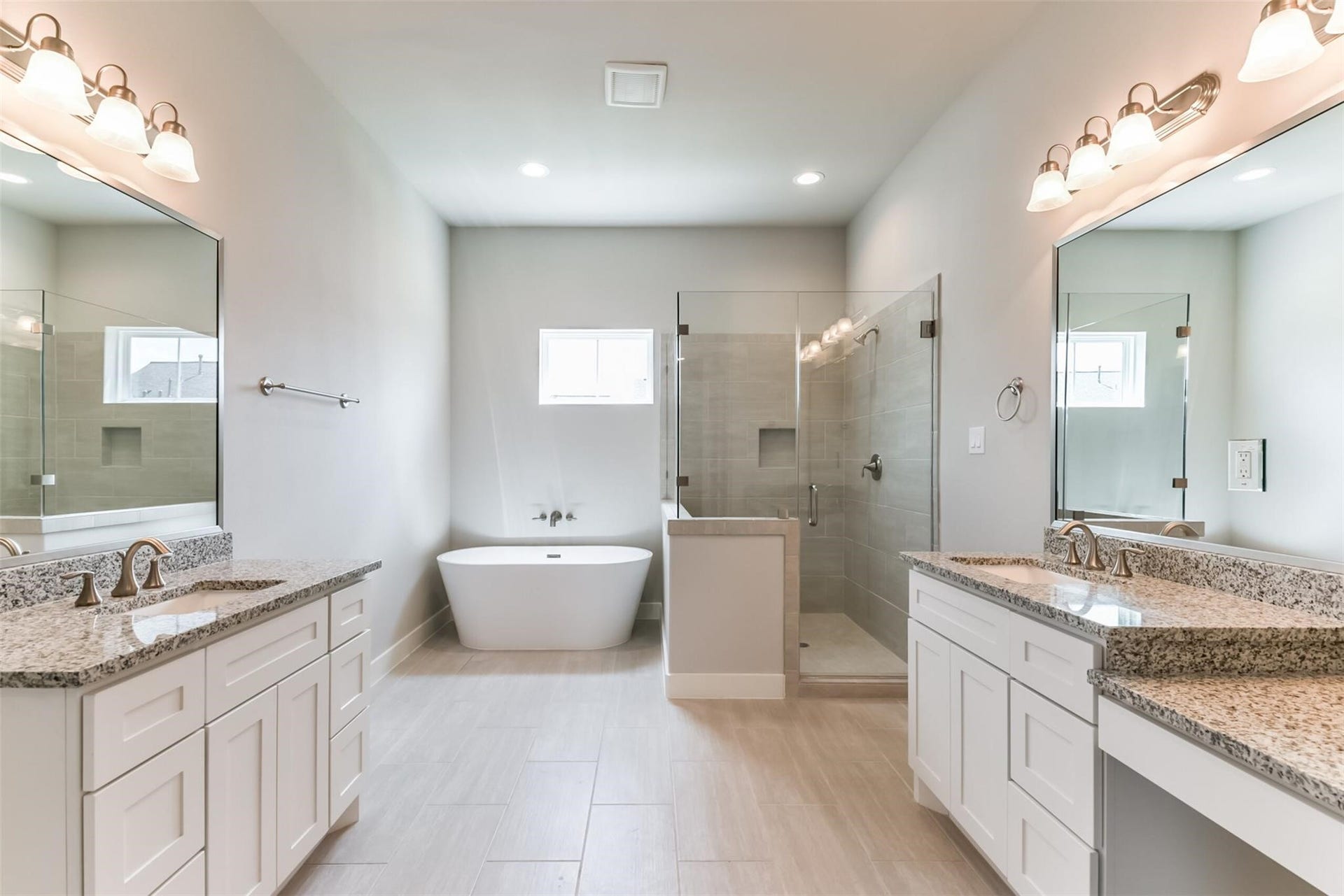 10906 Brookeshire Chase Lane Lane, Houston, TX 77043 Fabulous & elegant Primary Bathroom with double vanities, frameless glass enclosed shower plus a soaking tub.