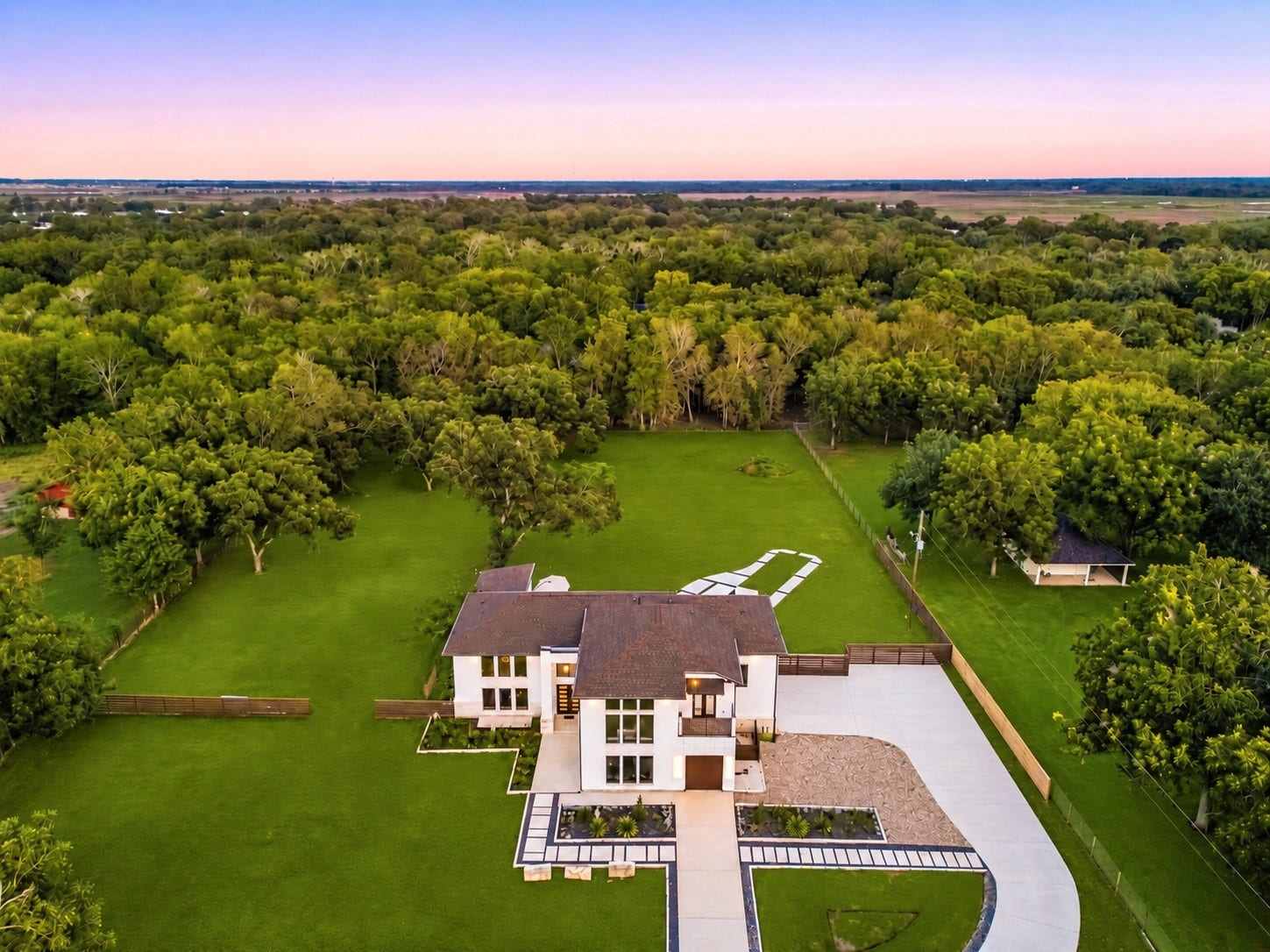 6830 Bois D Arc Lane, Fulshear, TX 77406 Private, peaceful, and designed for moments that stay with you this aerial view reveals the estate's tree-lined grounds and rare sense of seclusion.