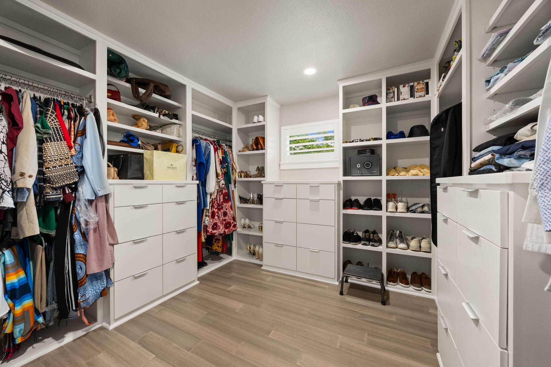 6830 Bois D Arc Lane, Fulshear, TX 77406 The primary closet offers extensive custom built-ins, including floor-to-ceiling shelving, drawer storage, and dedicated shoe display.