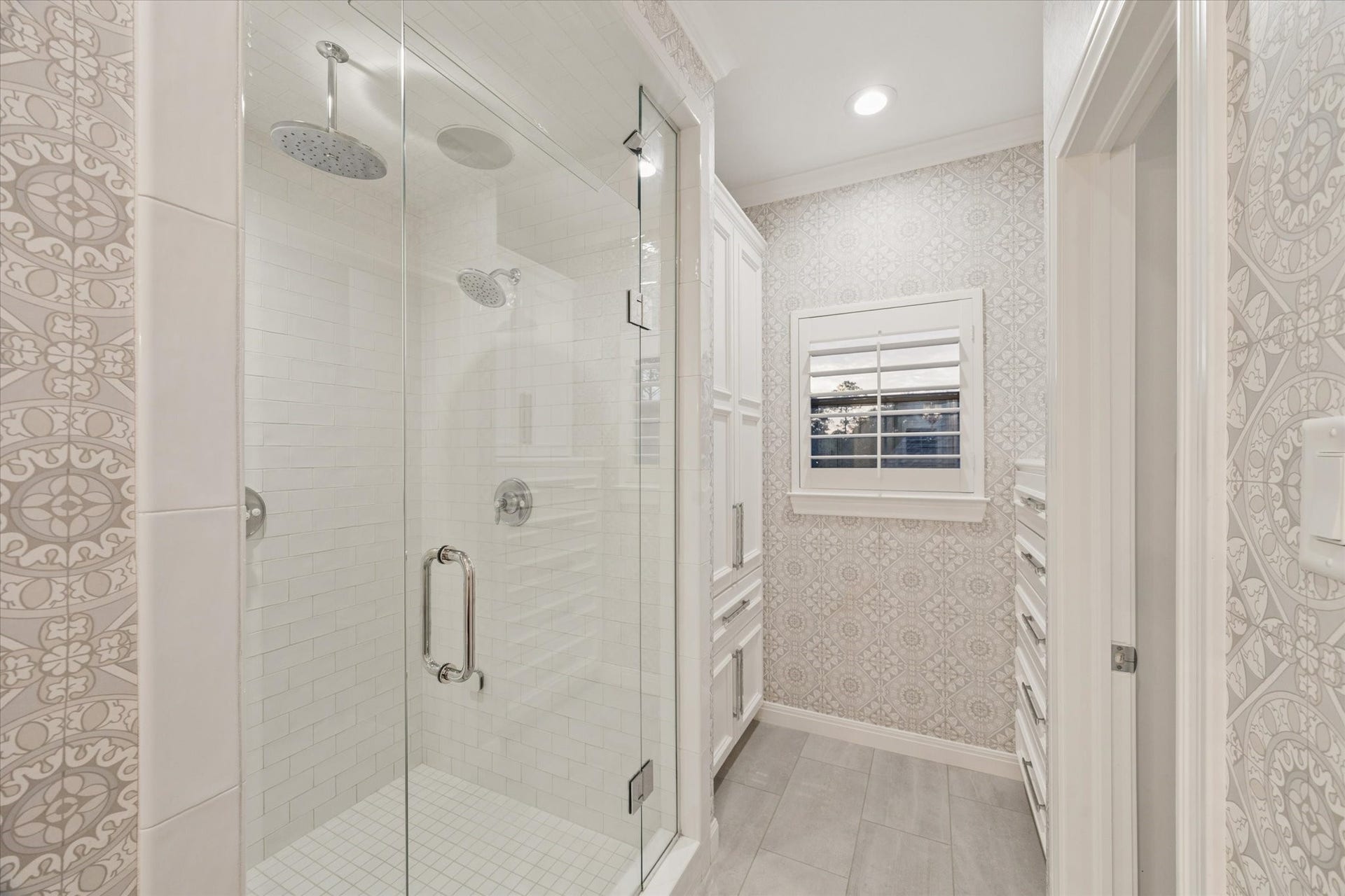 Steam shower and water closet in the primary suite.