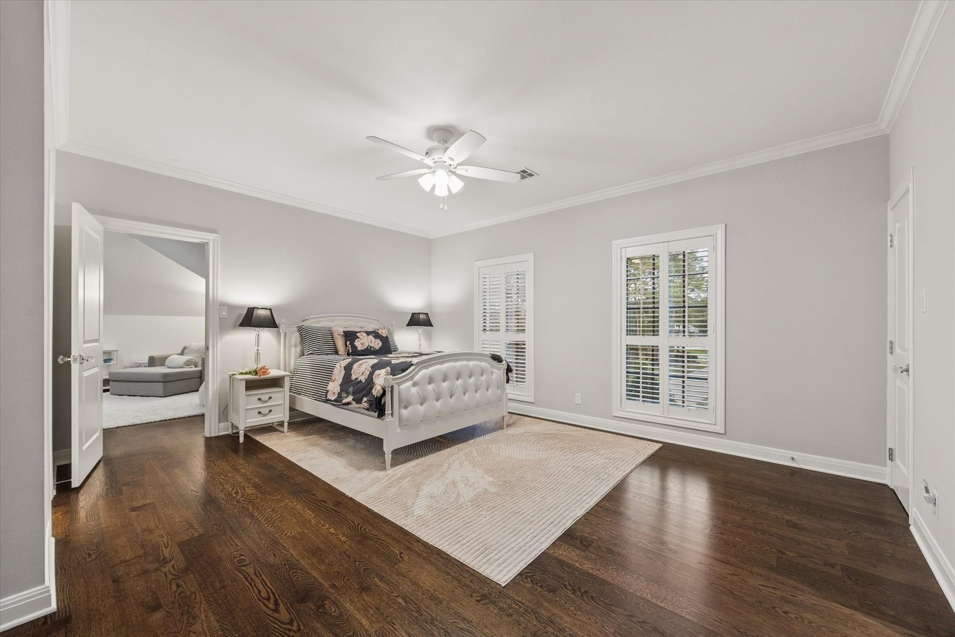 This bedroom is one of five, featuring an en-suite bathroom and an adjoining storage space suitable for use as a private study, craft room, or lounge area.