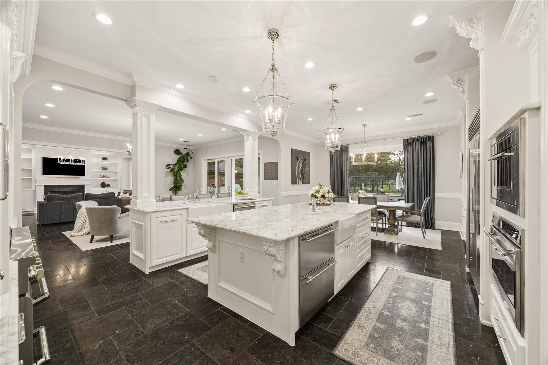 Another view of the timeless kitchen, featuring premium finishes, custom cabinetry, and high-end stainless steel appliances designed for both daily functionality and elegant entertaining.