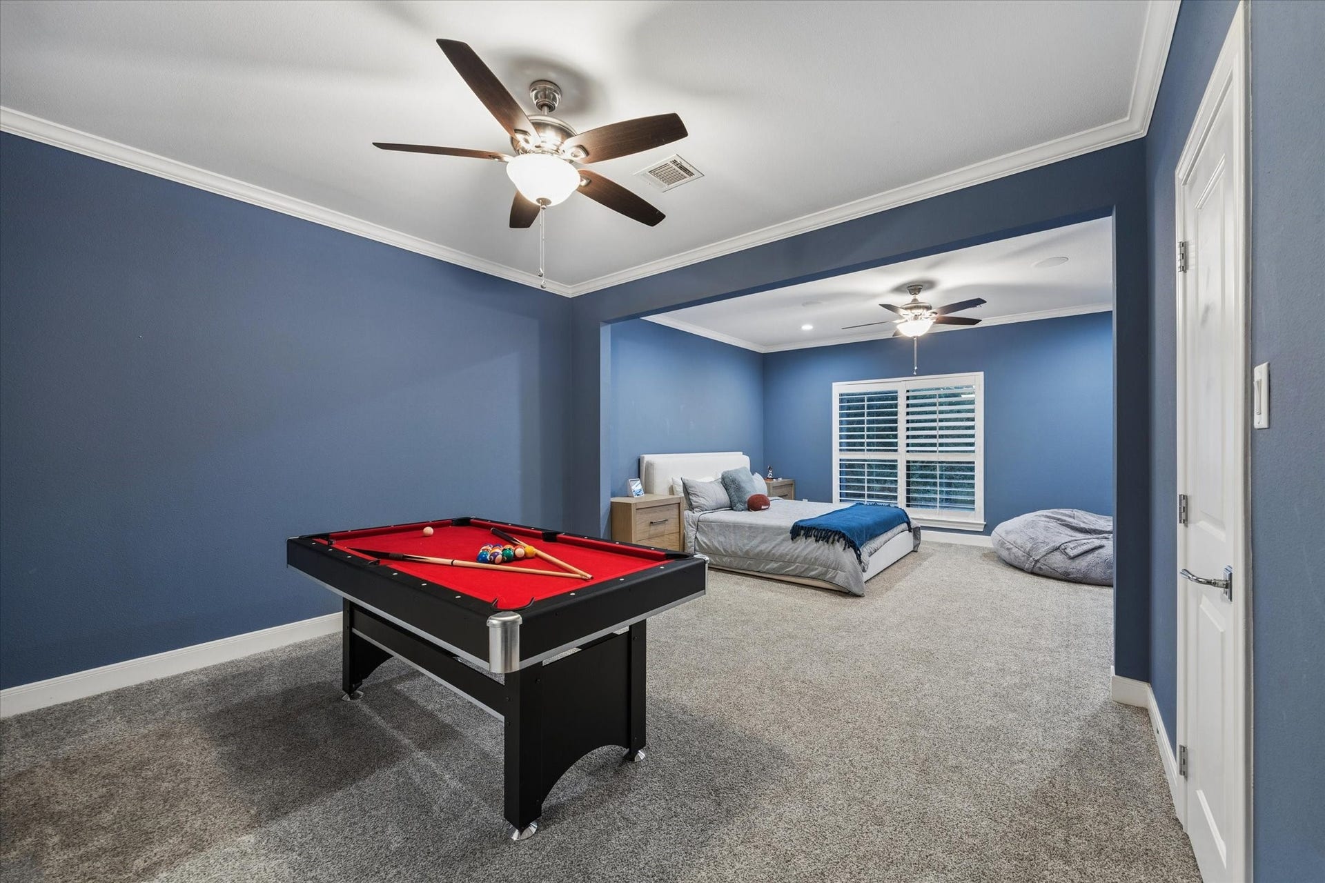 Secondary bedroom overlooking the pool with extra space to relax and unwind.