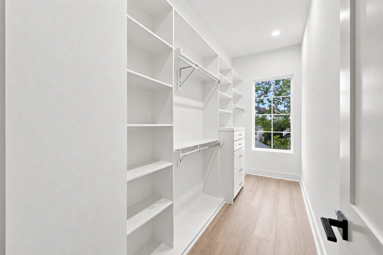 One of two primary closets.