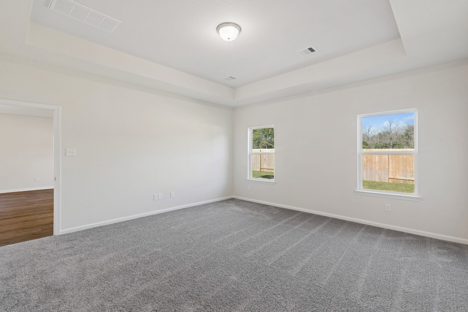 The Crawford- Primary Suite with Tray Ceiling. Home under construction, sample photo used for illustrative purposes only, colors and options will vary.