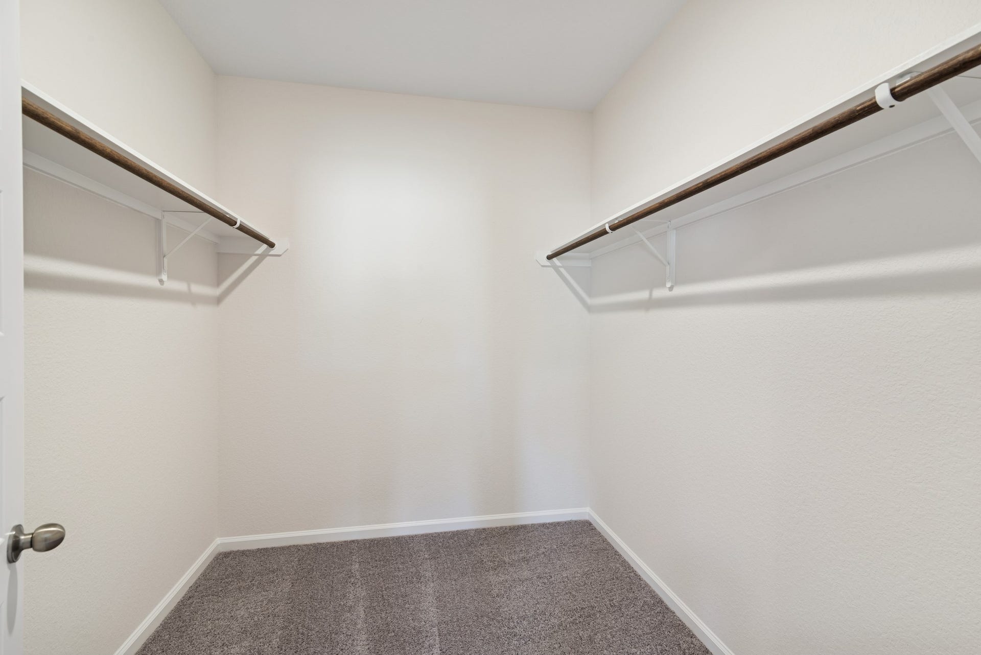 The Crawford- Primary Suite Walk-In Closet. Home under construction, sample photo used for illustrative purposes only, colors and options will vary.