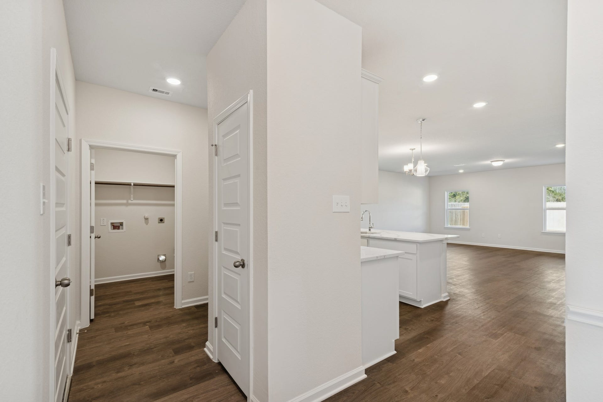 The Crawford- Hall to Utility Room. Home under construction, sample photo used for illustrative purposes only, colors and options will vary.