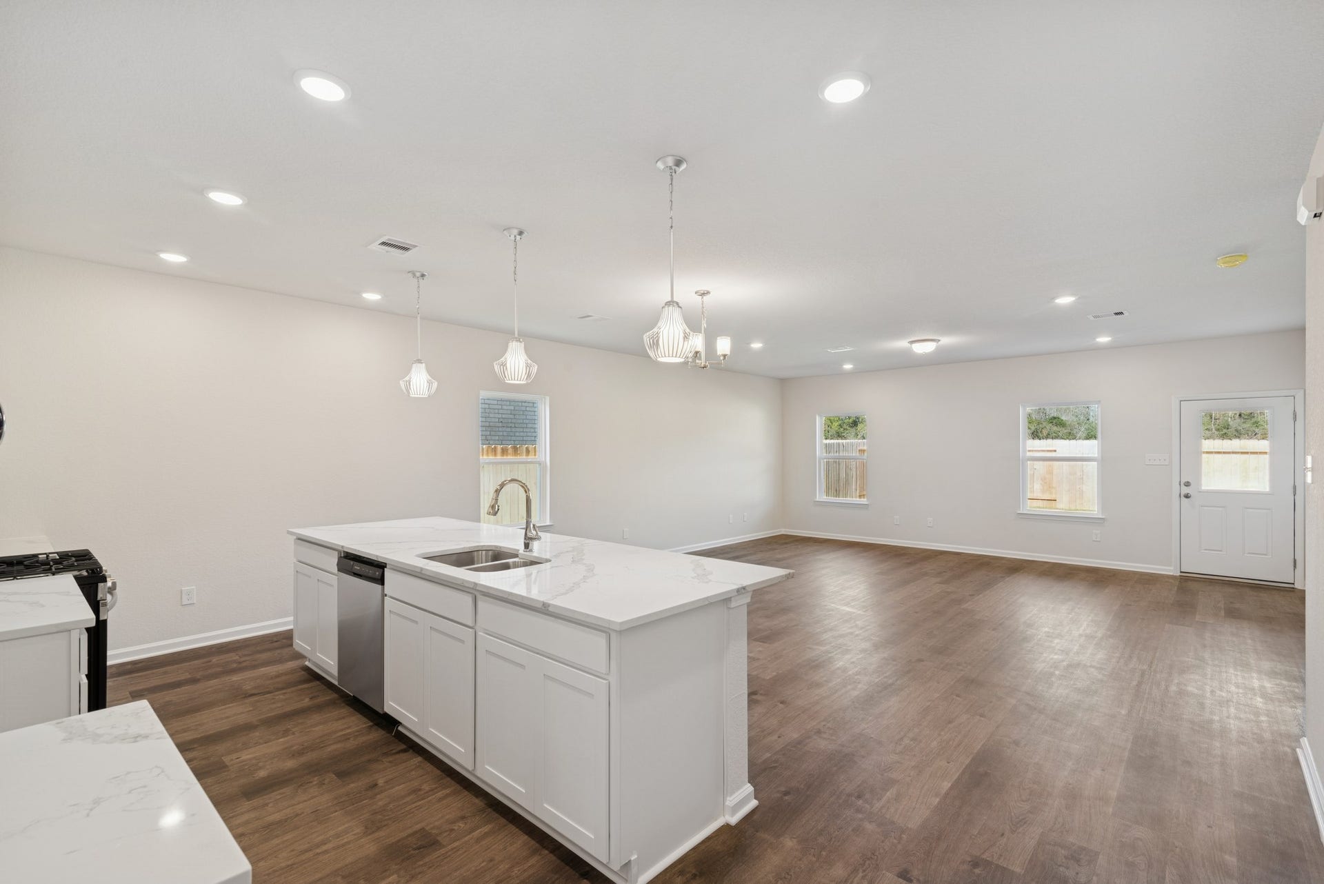 The Crawford- Kitchen into Family Room. Home under construction, sample photo used for illustrative purposes only, colors and options will vary.