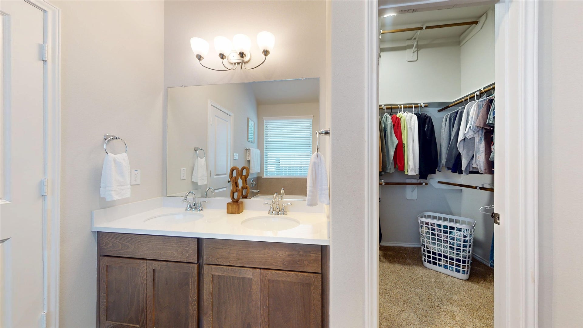 2926 Yaupon Grove Lane, Conroe, TX 77385 Double sinks, nice size primary closet with seasonal storage.