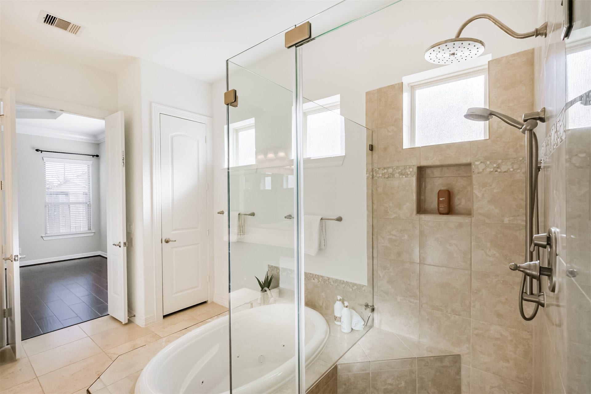 10 Silent Way Drive, Sugar Land, TX 77498 Spacious frameless shower with dual heads and separate controls.