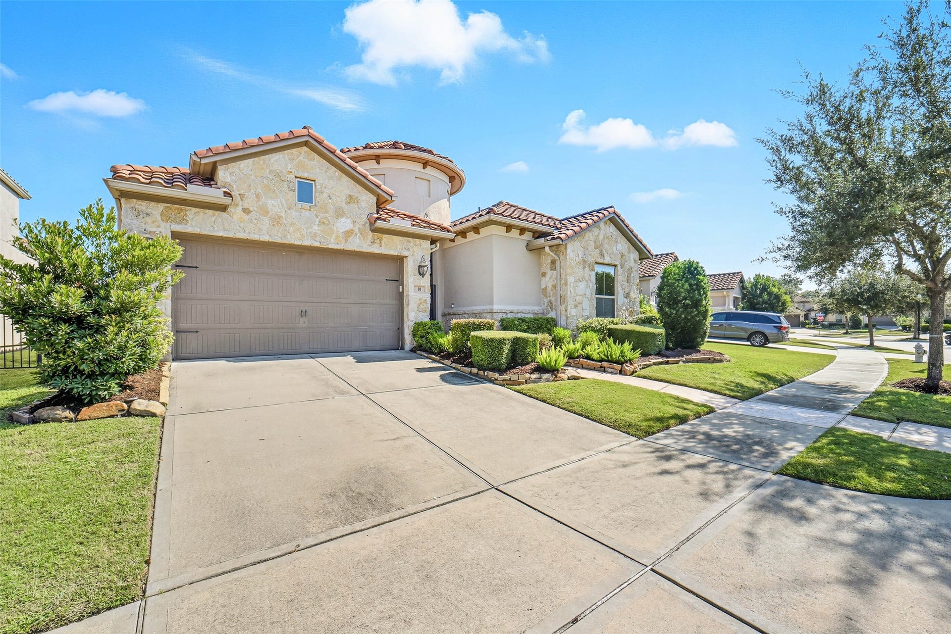 10 Silent Way Drive, Sugar Land, TX 77498 Double wide driveway that leads to a tandem 3 car garage.