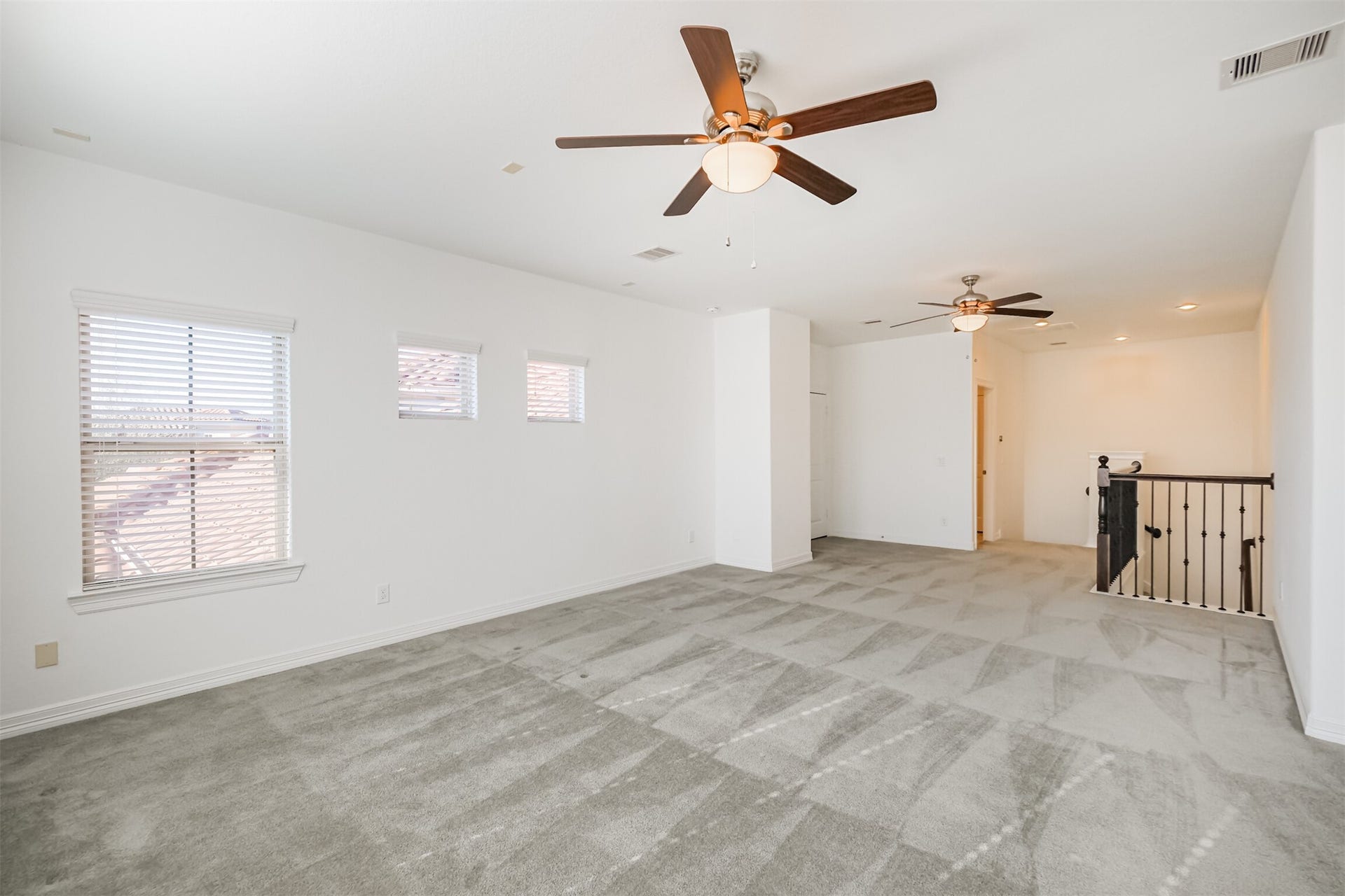 10 Silent Way Drive, Sugar Land, TX 77498 Expansive game room on the second floor offers comfortable space with two ceiling fans and half bath.