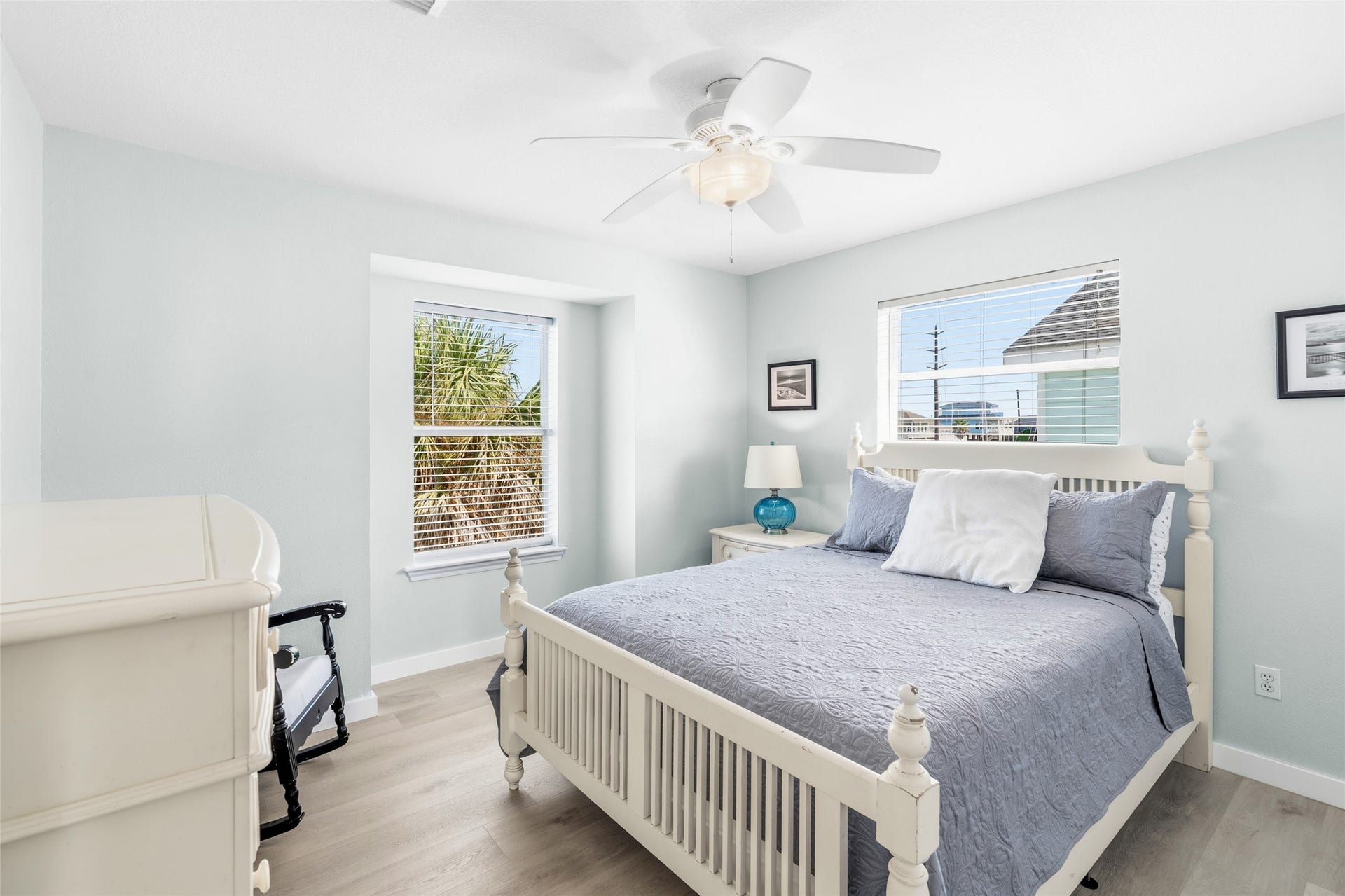 21631 Termini San Luis Pass Road, Galveston, TX 77554 Bright and inviting bedroom features a ceiling fan and ample natural light from two windows.