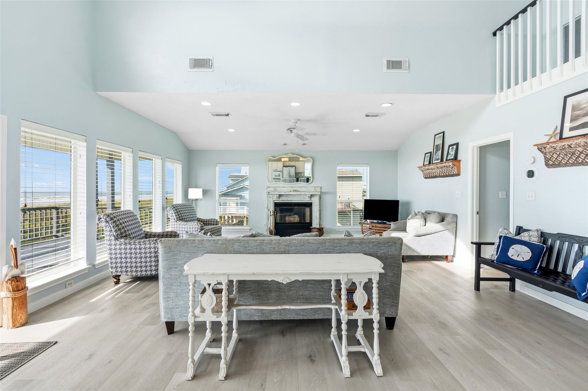 21631 Termini San Luis Pass Road, Galveston, TX 77554 Spacious living room features high ceilings and a cozy fireplace.