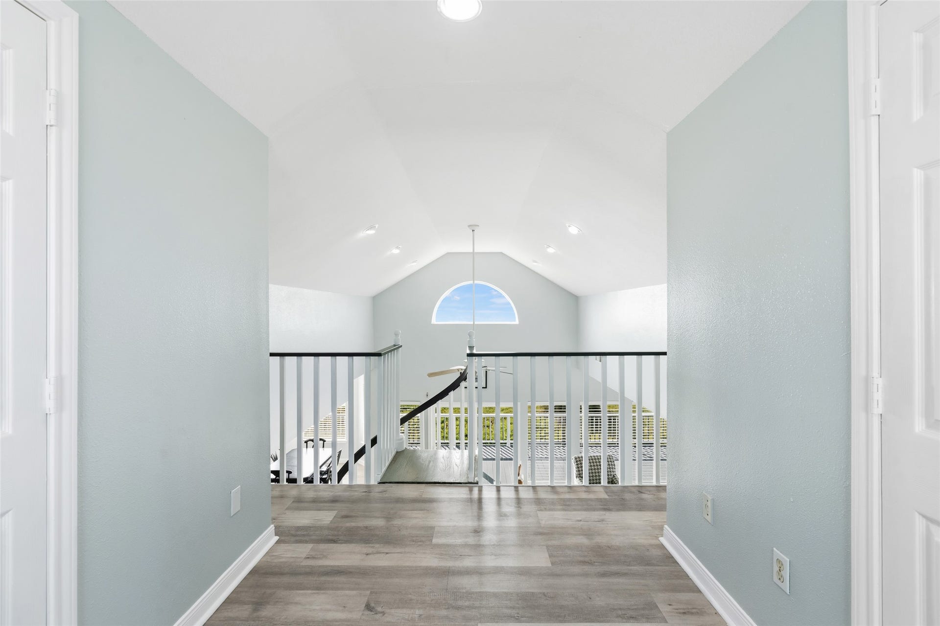 21631 Termini San Luis Pass Road, Galveston, TX 77554 Bright and airy space upstairs features a large arched window that enhances natural light and provides an open feel.