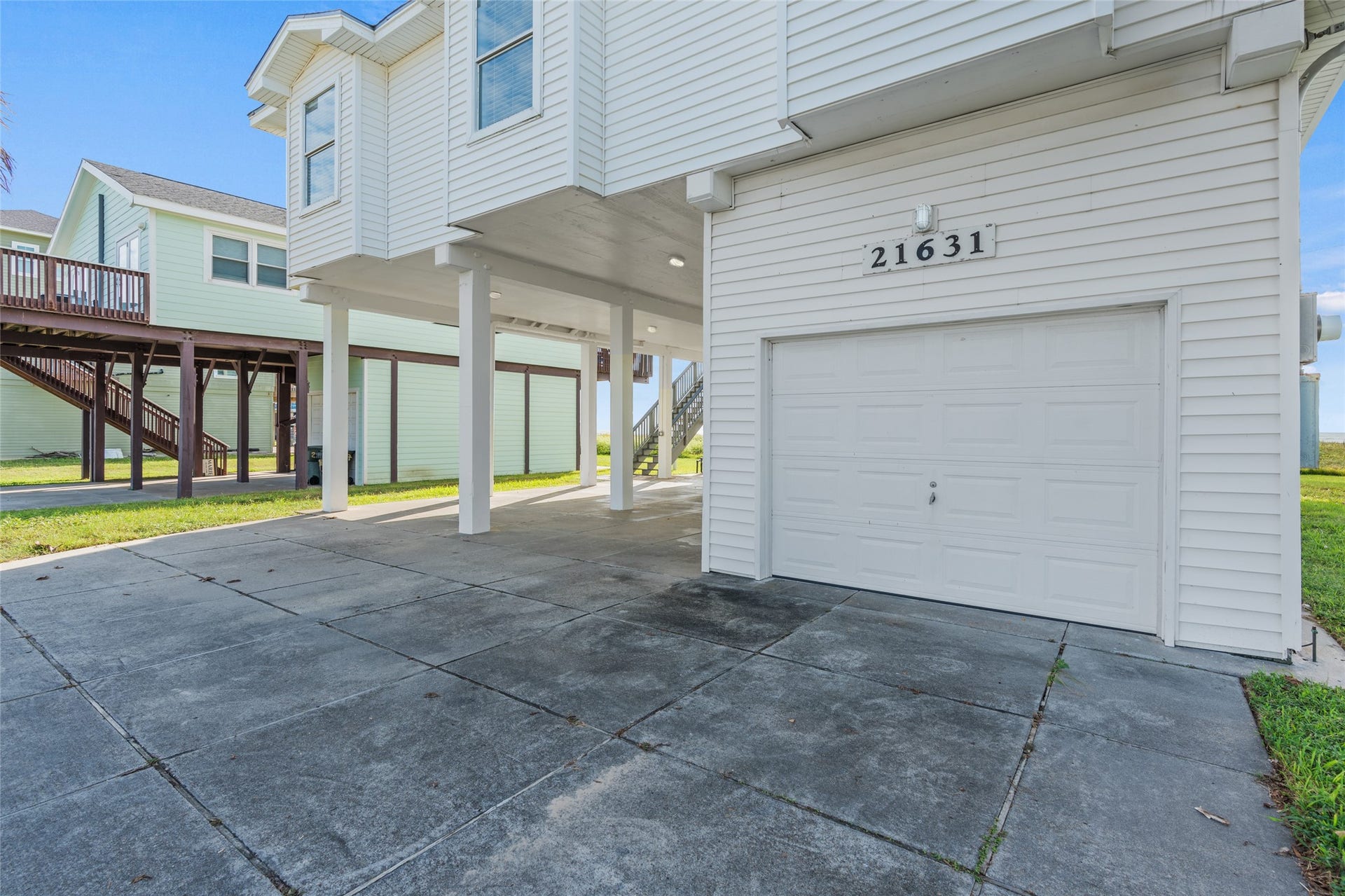 21631 Termini San Luis Pass Road, Galveston, TX 77554 Coastal home with spacious covered parking and a convenient garage, perfect for beach life.