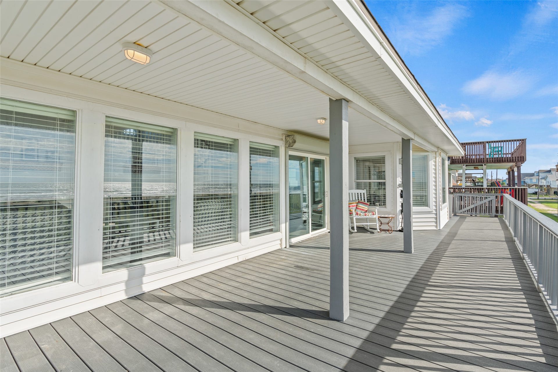 21631 Termini San Luis Pass Road, Galveston, TX 77554 Porch with elegant railings and ample natural light, perfect for relaxing and enjoying outdoor views.