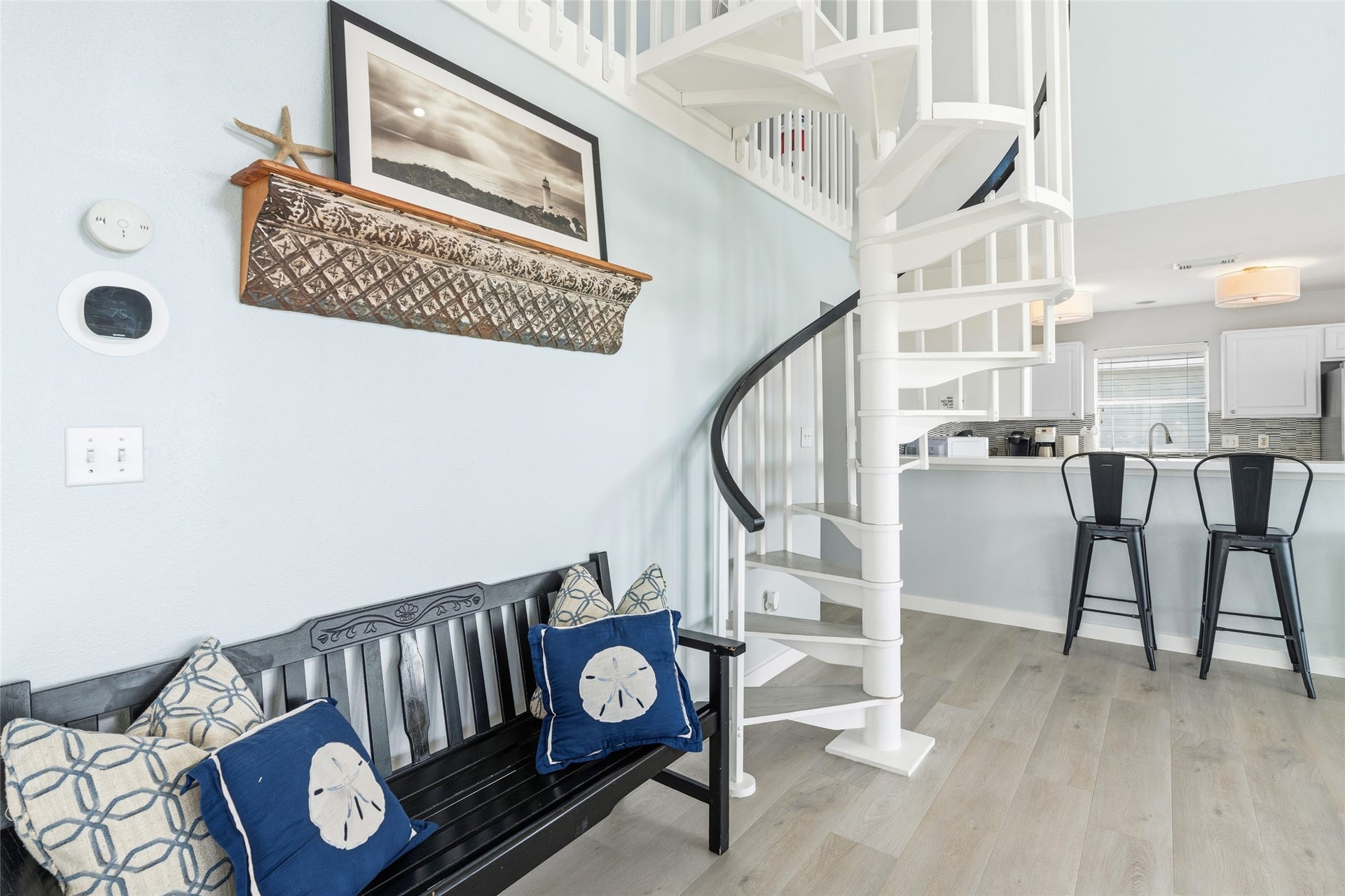 21631 Termini San Luis Pass Road, Galveston, TX 77554 Charming living area shows the spiral staircase leading to the extra living area.