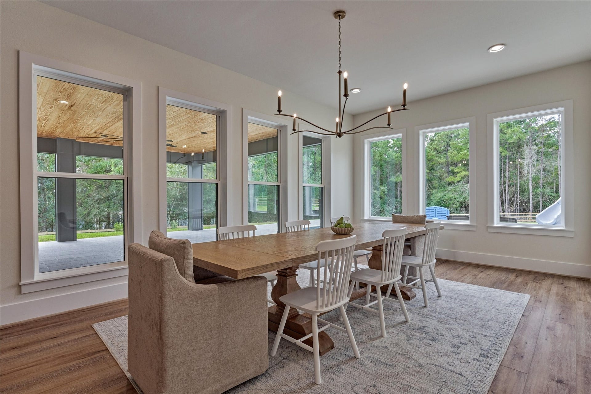 8616 Grand Lake Estates Drive, Montgomery, TX 77316 Wrapped in walls of windows