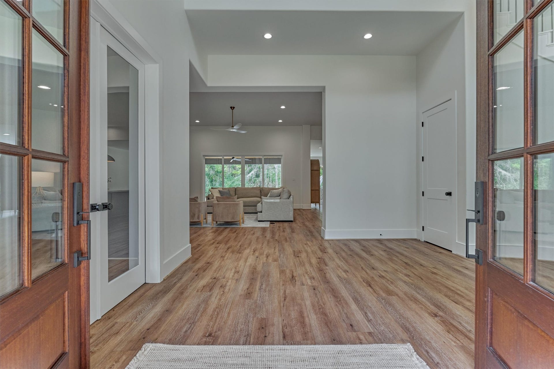 8616 Grand Lake Estates Drive, Montgomery, TX 77316 Step inside to soaring ceilings, continuous LVP flooring, and upscale finishes throughout.