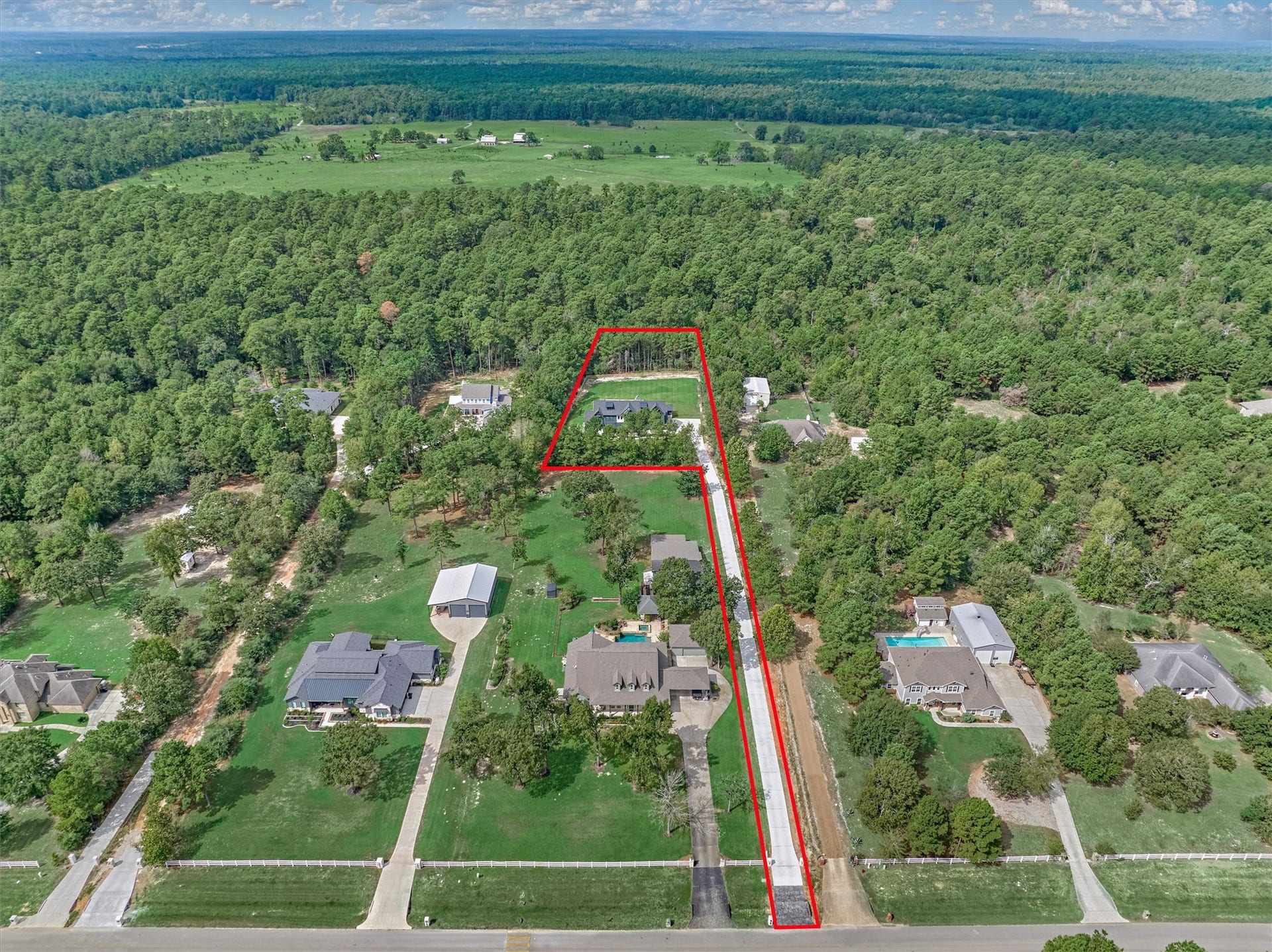 8616 Grand Lake Estates Drive, Montgomery, TX 77316 Cherish the private drive leading to this treasure, neatly tucked away for privacy in this serene country setting, and no rear neighbors! Note: See survey of lot with approx. 100' wooded reserve in back.