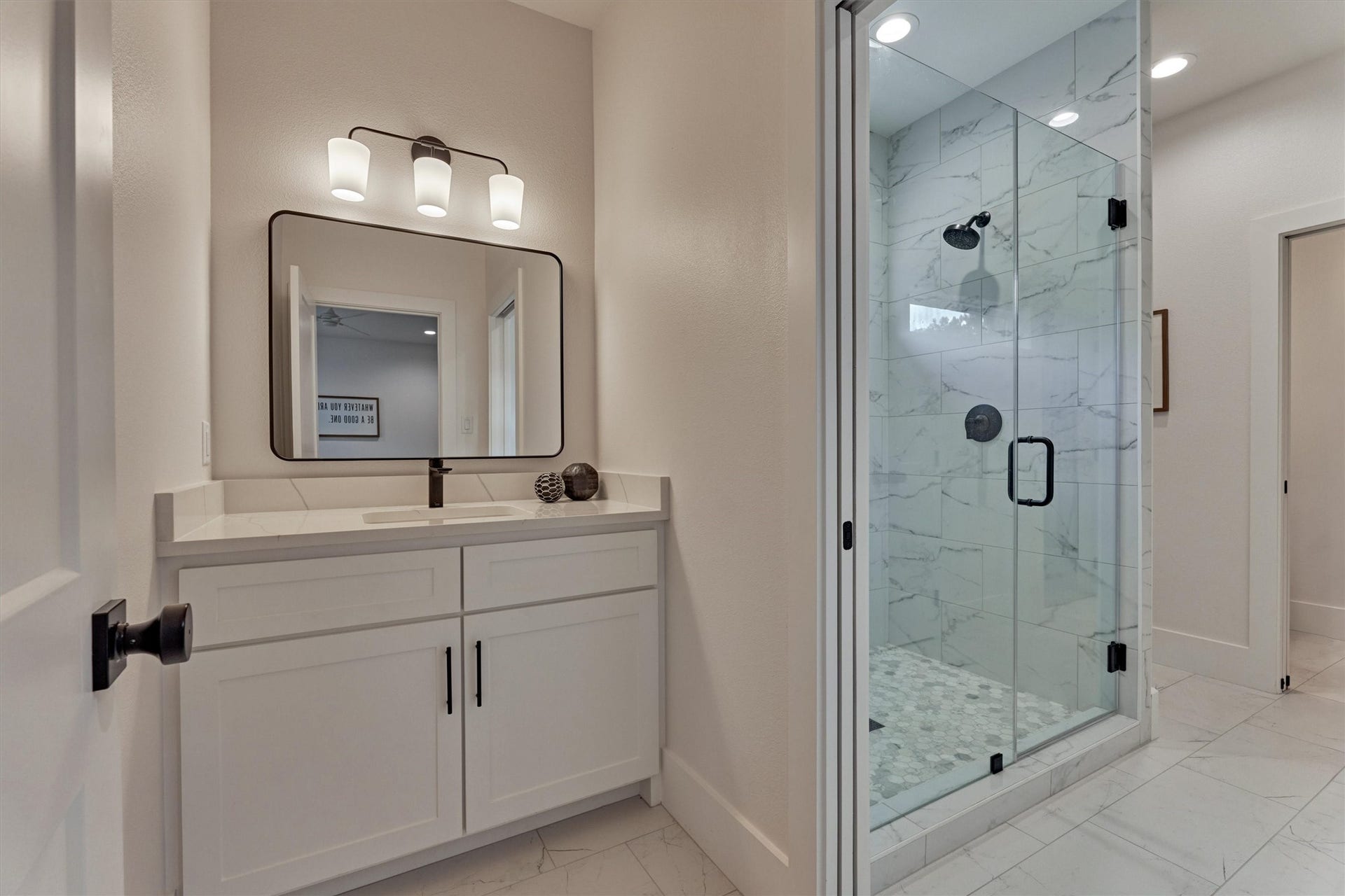 8616 Grand Lake Estates Drive, Montgomery, TX 77316 Jack-and-Jill bathroom shared by Secondary Bedrooms #4 and #5 features a spacious walk-in shower.