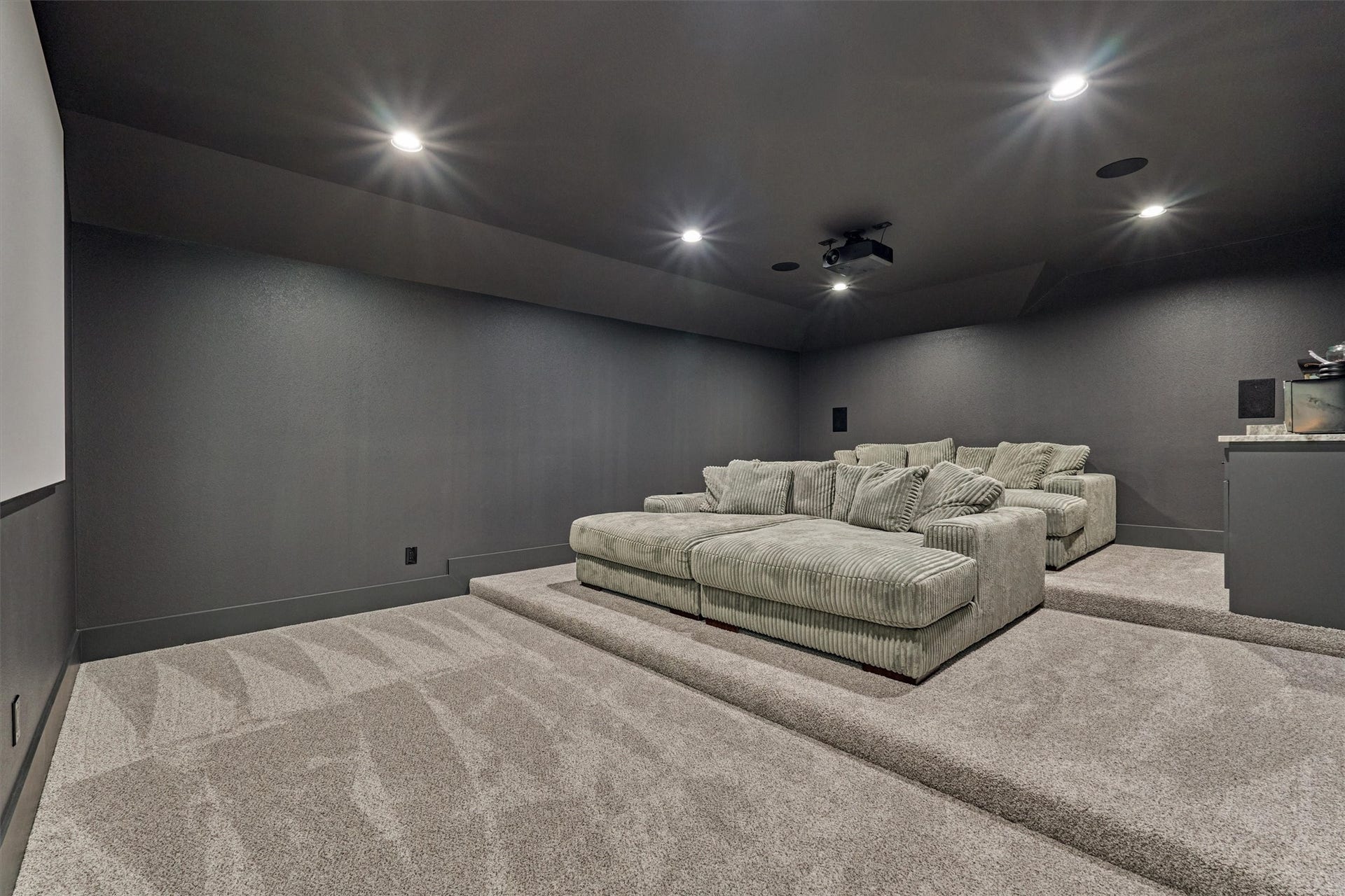 8616 Grand Lake Estates Drive, Montgomery, TX 77316 The dedicated media room will be your new favorite spot for movie nights, binge-watching your favorite shows, or playing video games with friends!