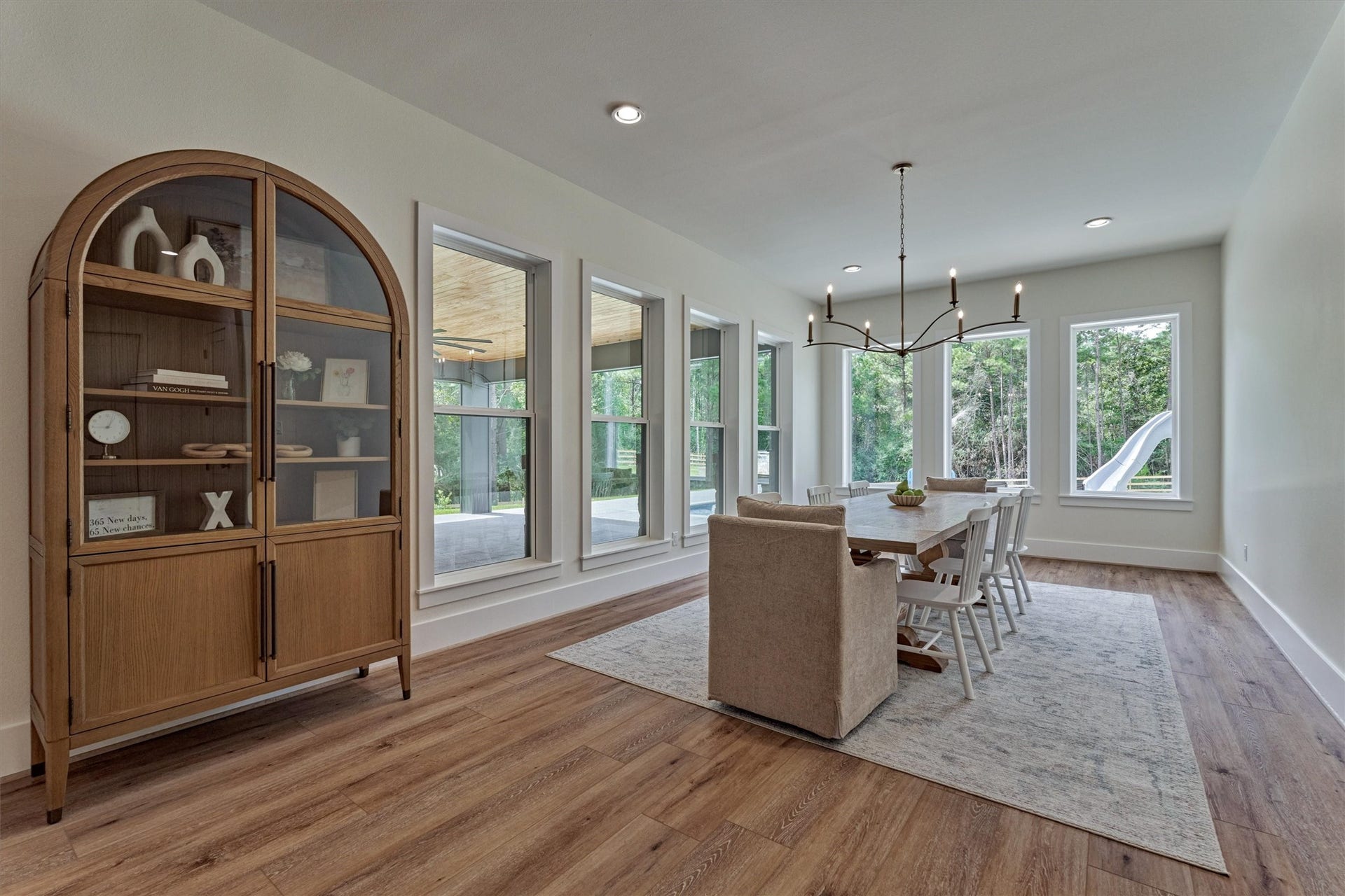 8616 Grand Lake Estates Drive, Montgomery, TX 77316 This sun-filled dining room is an entertainers dream, offering exceptional space to accommodate all your large dining pieces with ease.
