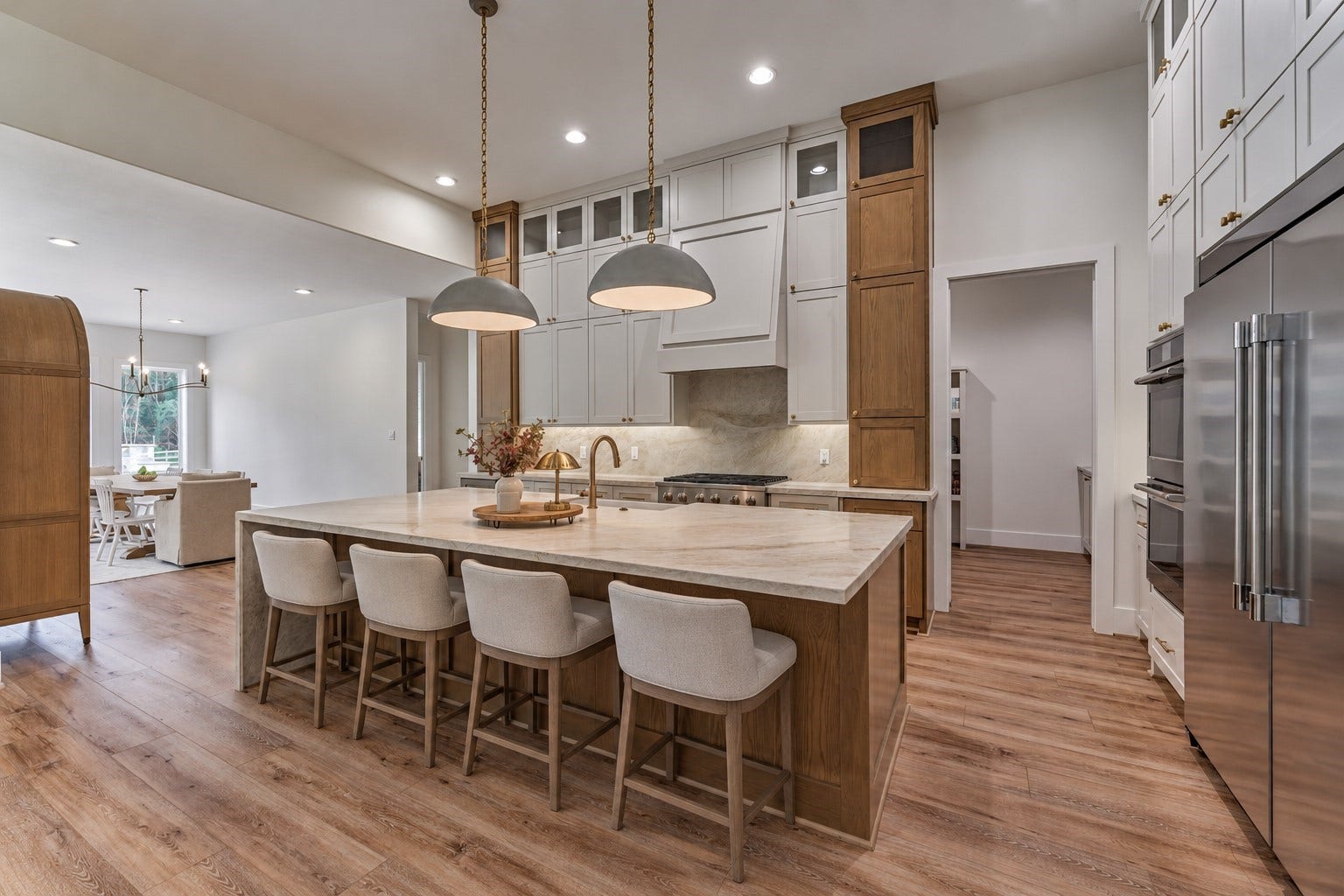 8616 Grand Lake Estates Drive, Montgomery, TX 77316 *This is a virtually staged photo* Stop and take a moment to appreciate this jaw-dropping gourmet chefs kitchen, featuring a massive island with bar seating, stunning quartz countertops, and so much more! Note easy access to a colossal-sized pantry with dry bar!