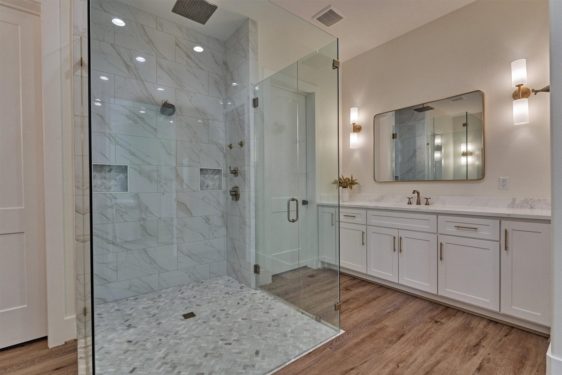 8616 Grand Lake Estates Drive, Montgomery, TX 77316 This luxe bathroom flaunts separate vanities and a HUGE walk-in closet with exceptional storage space!
