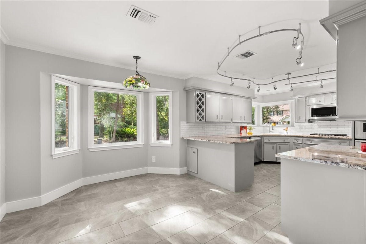 The breakfast nook sits conveniently located off of the kitchen and offers plenty of room to move about.