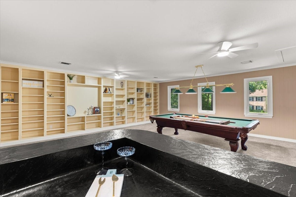 The gameroom has built in cabinets, a storage closet and a full wet-bar with space to add a refrigerator and more.