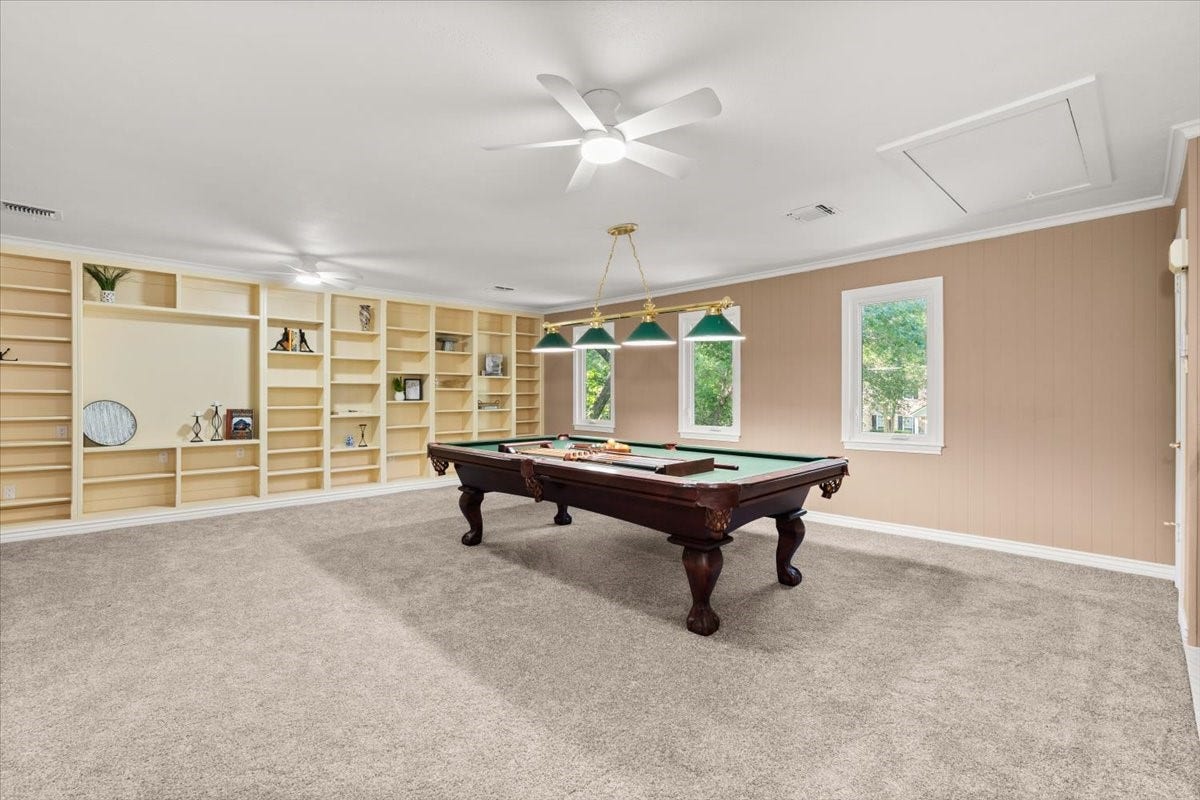 The gameroom, located above the garage and in it's own separate space comes with the pool table.