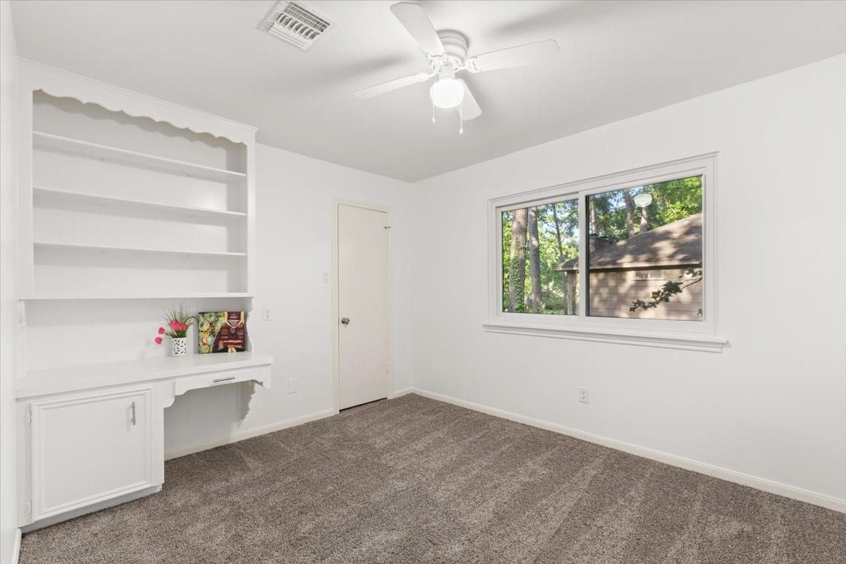 Upstairs Bedroom 2 features a built-in desk, brand-
new carpet, and fresh paint.
