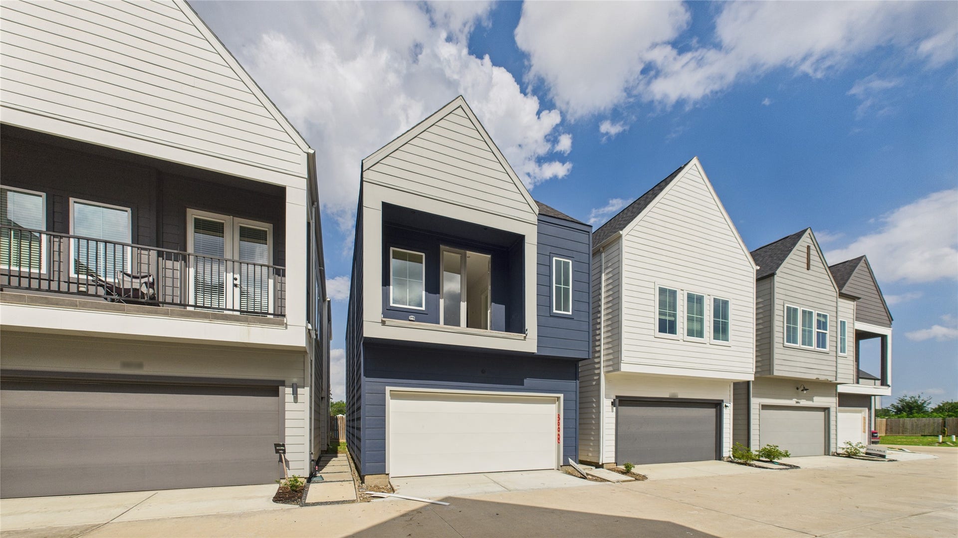 This thoughtfully designed two-story residence offers the perfect blend of modern living and practical layout. The second floor features an open-concept living, dining, and kitchen area, creating a seamless flow ideal for entertaining. Expansive windows and direct access to a private balcony from the living room invite natural light and fresh air, enhancing the indoor-outdoor experience.