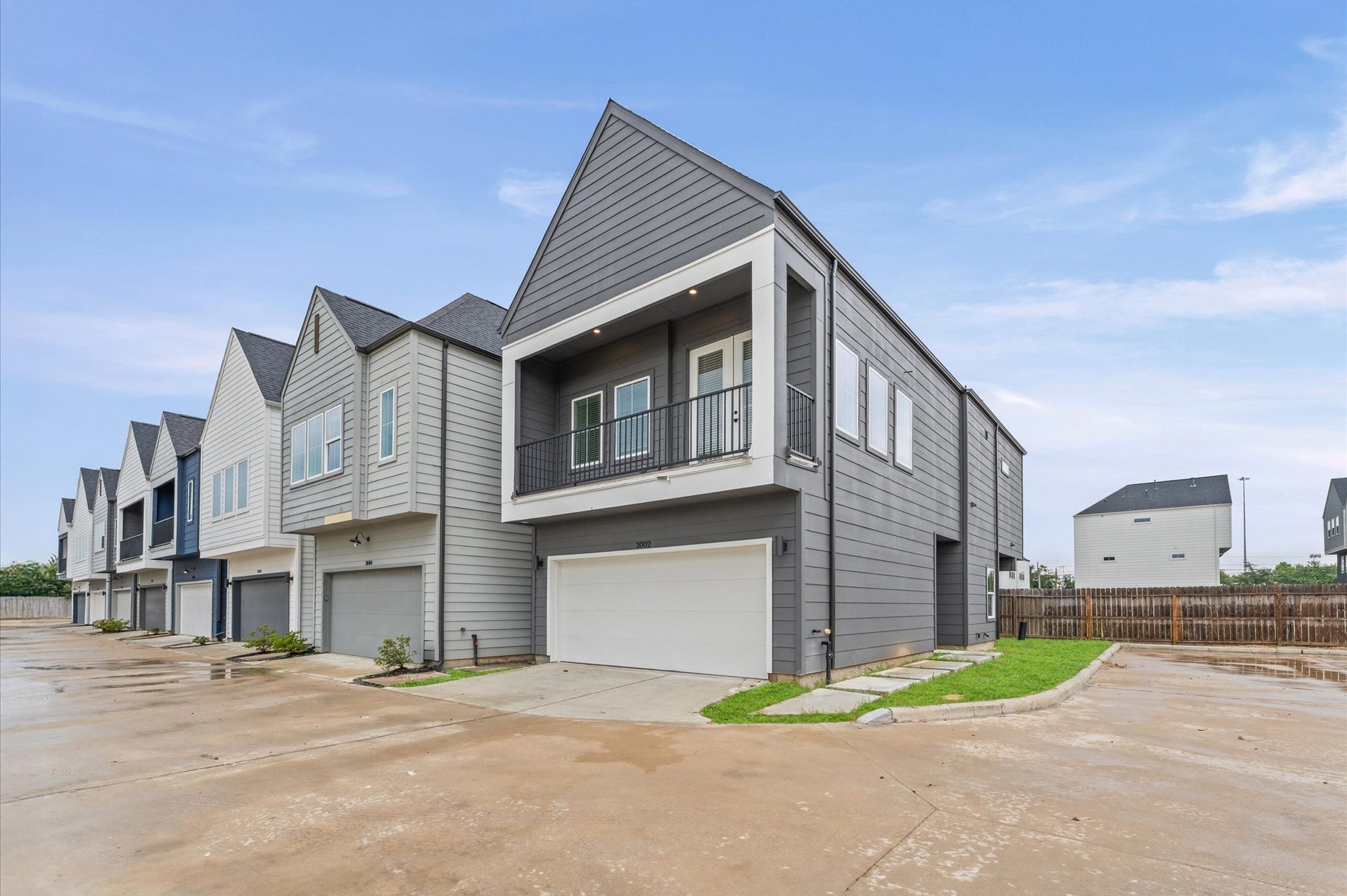 This thoughtfully designed two-story residence offers the perfect blend of modern living and practical layout. The second floor features an open-concept living, dining, and kitchen area, creating a seamless flow ideal for entertaining. Expansive windows and direct access to a private balcony from the living room invite natural light and fresh air, enhancing the indoor-outdoor experience.
