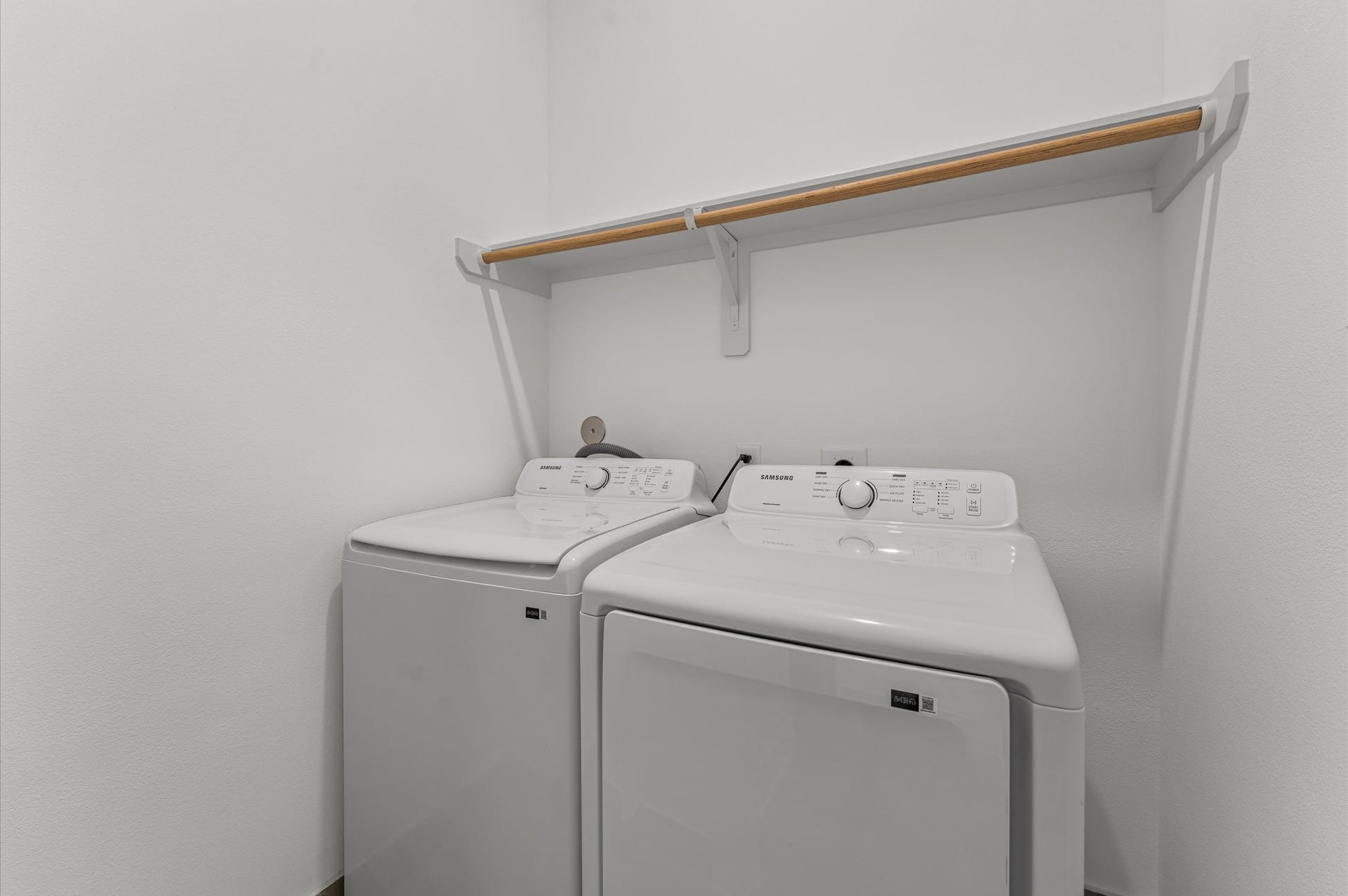 Conveniently located on the second floor, this well-appointed laundry room offers easy access from nearby bedroomsstreamlining daily routines and eliminating the need to carry laundry up and down stairs.